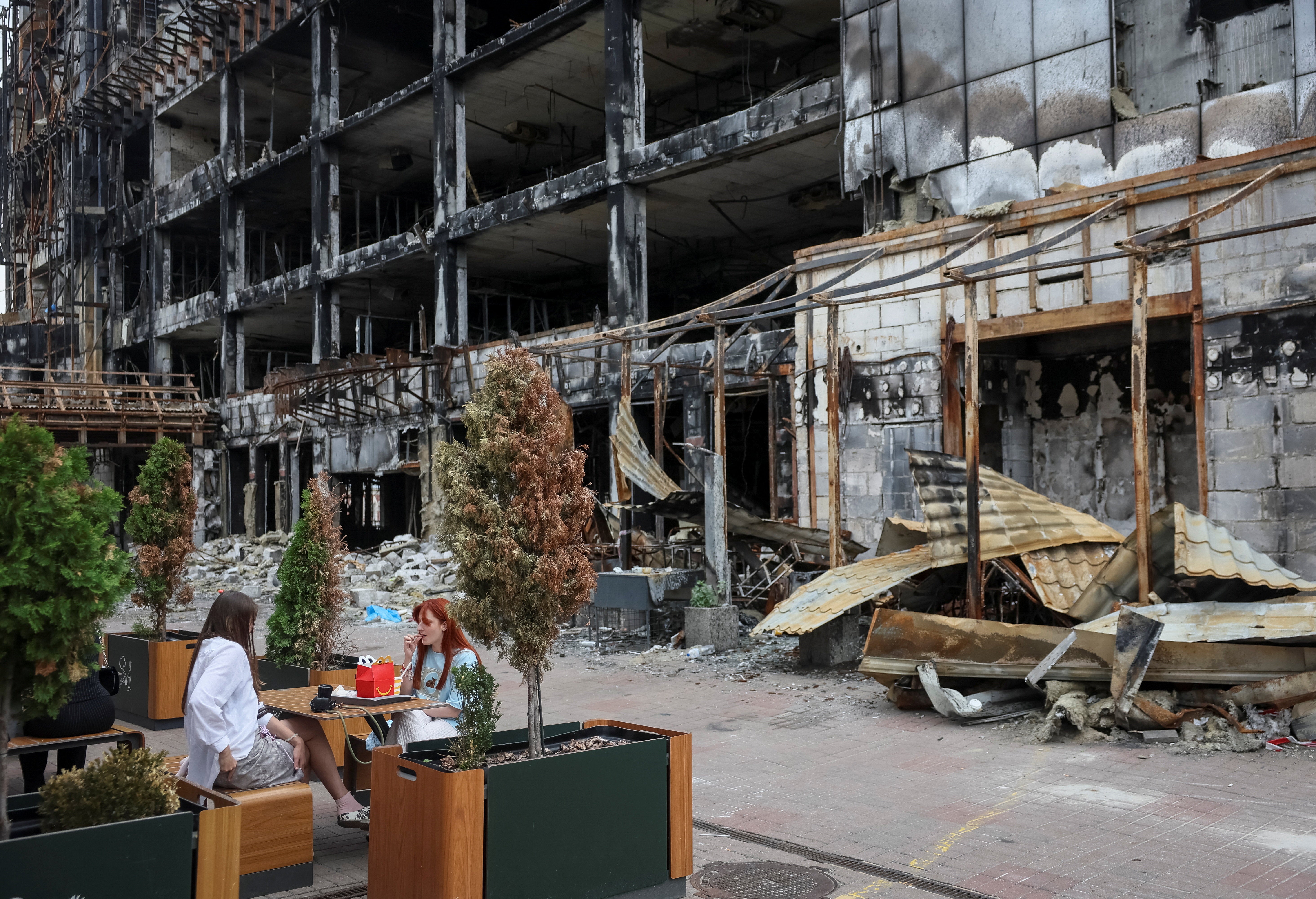 People visit a McDonald's restaurant which was the first to open in Ukraine in 1997, located in an area that was hit by ​​numerous missile attacks (Reuters)