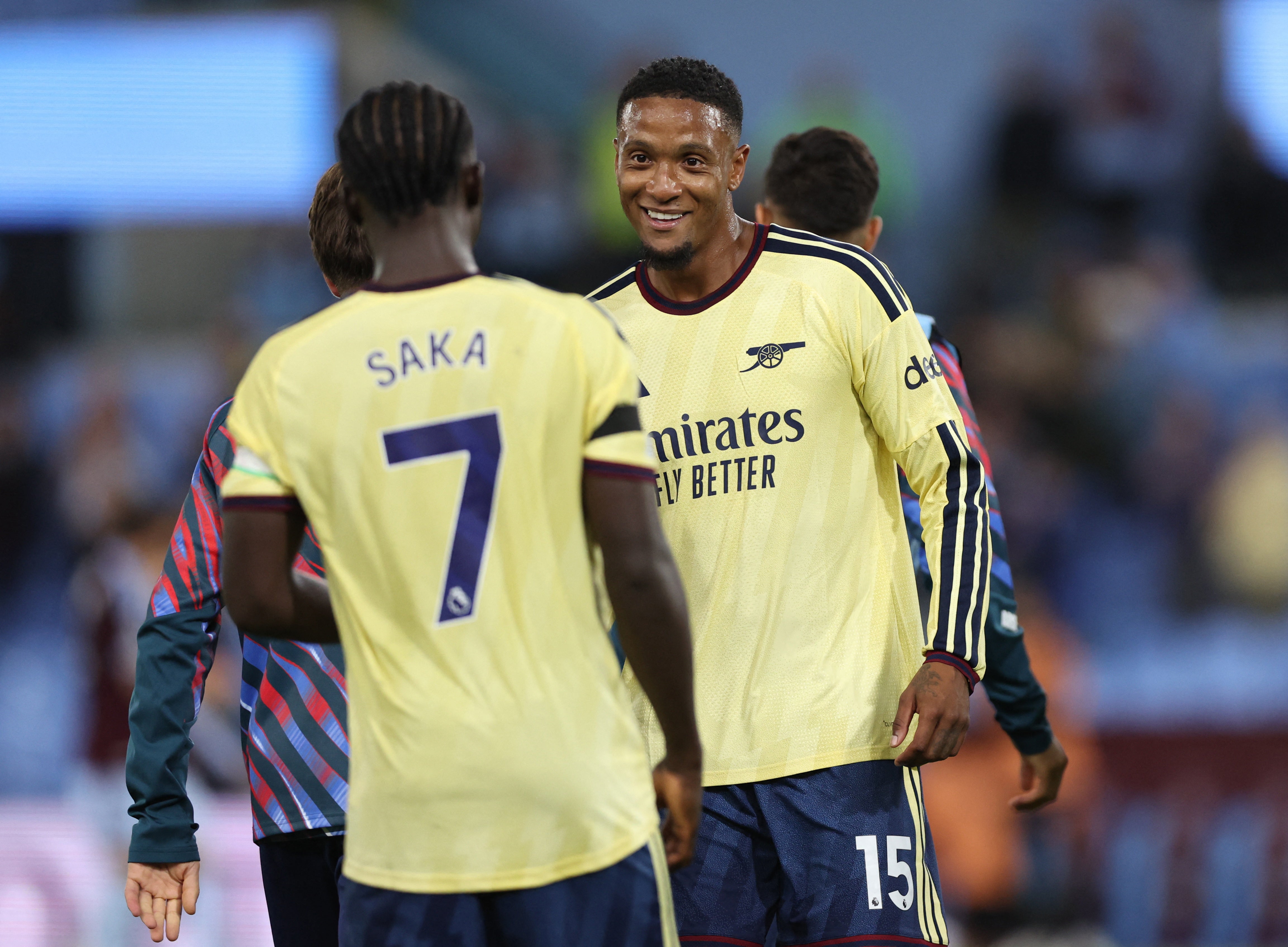 Arsenal's Bukayo Saka and Ezri Konsa celebrate after the match