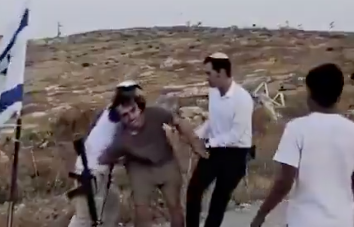 Footage shows Joughin's arms being wrestled behind his back