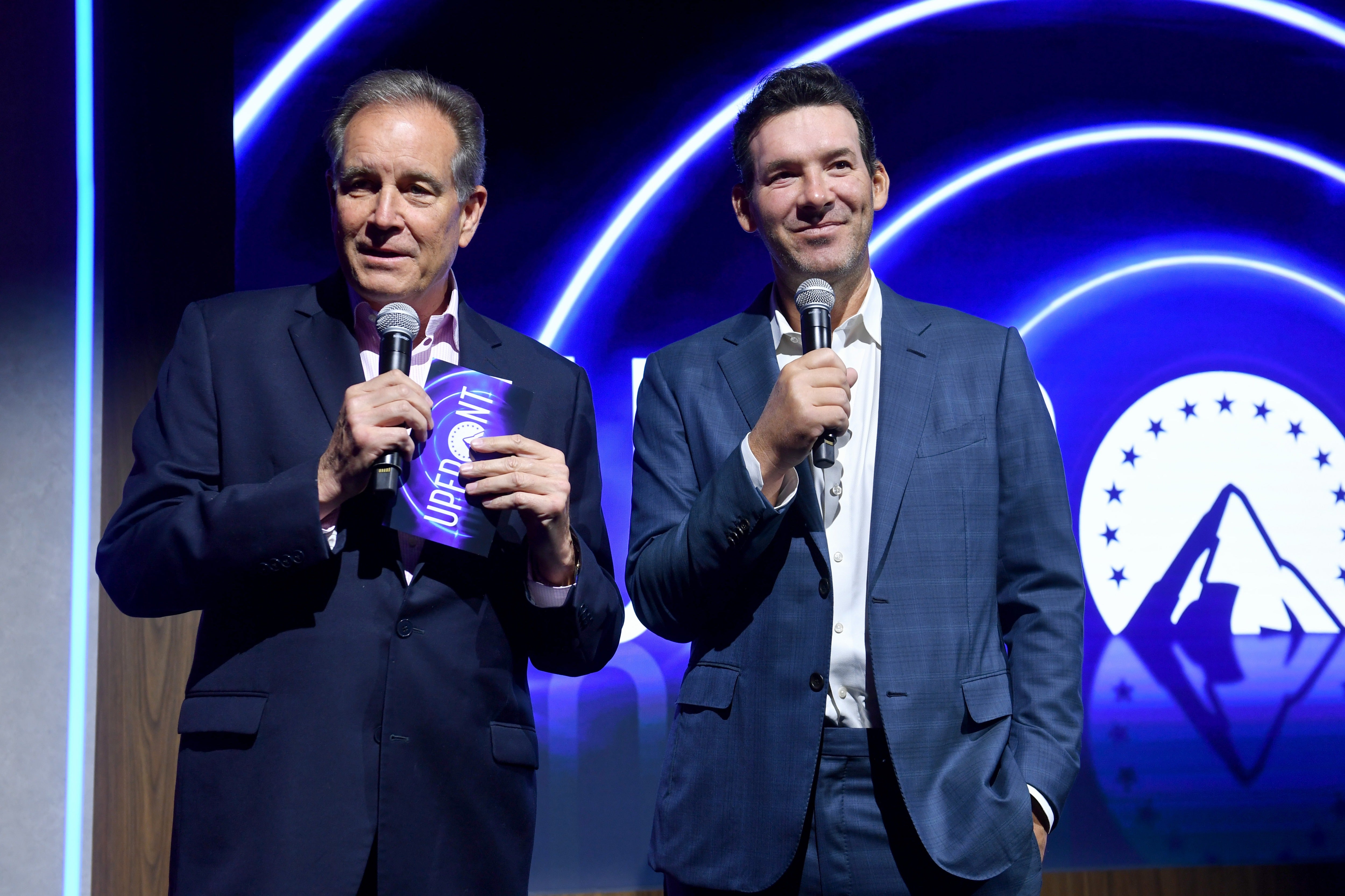 CBS Sports placed Romo (right) on leave from his primary position as the network's lead game analyst after his arrest (Getty Images for Paramount)