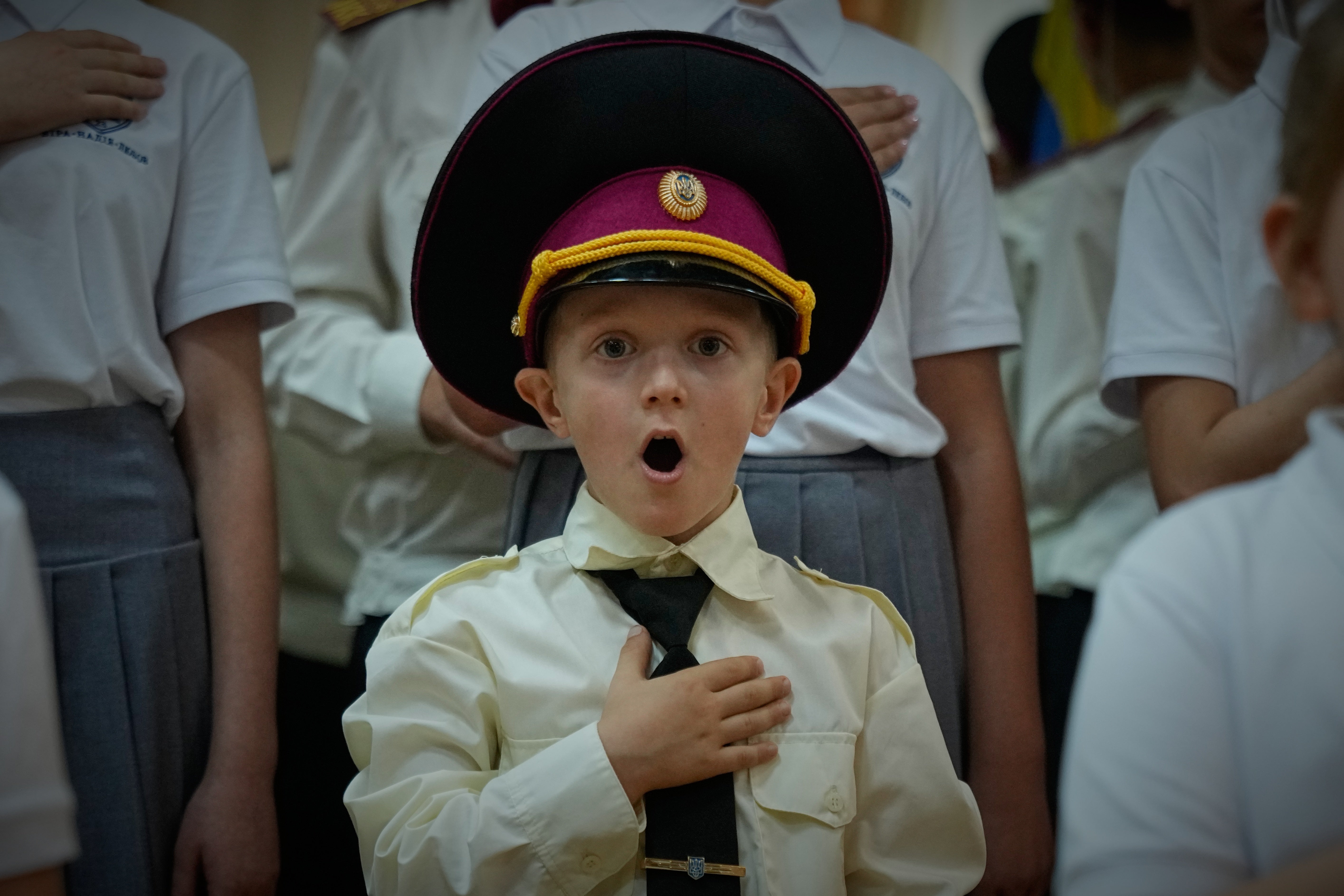 Cadets sing the national anthem on the first day at school in a cadet lyceum in Kyiv, Ukraine, Tuesday, Sept. 1, 2026. (AP Photo/Efrem Lukatsky)