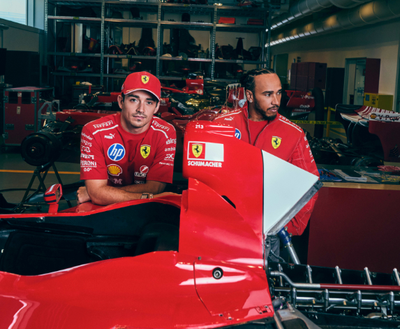 Charles Leclerc and Lewis Hamilton pose next to the Schumacher-inspired livery (Scuderia Ferrari)