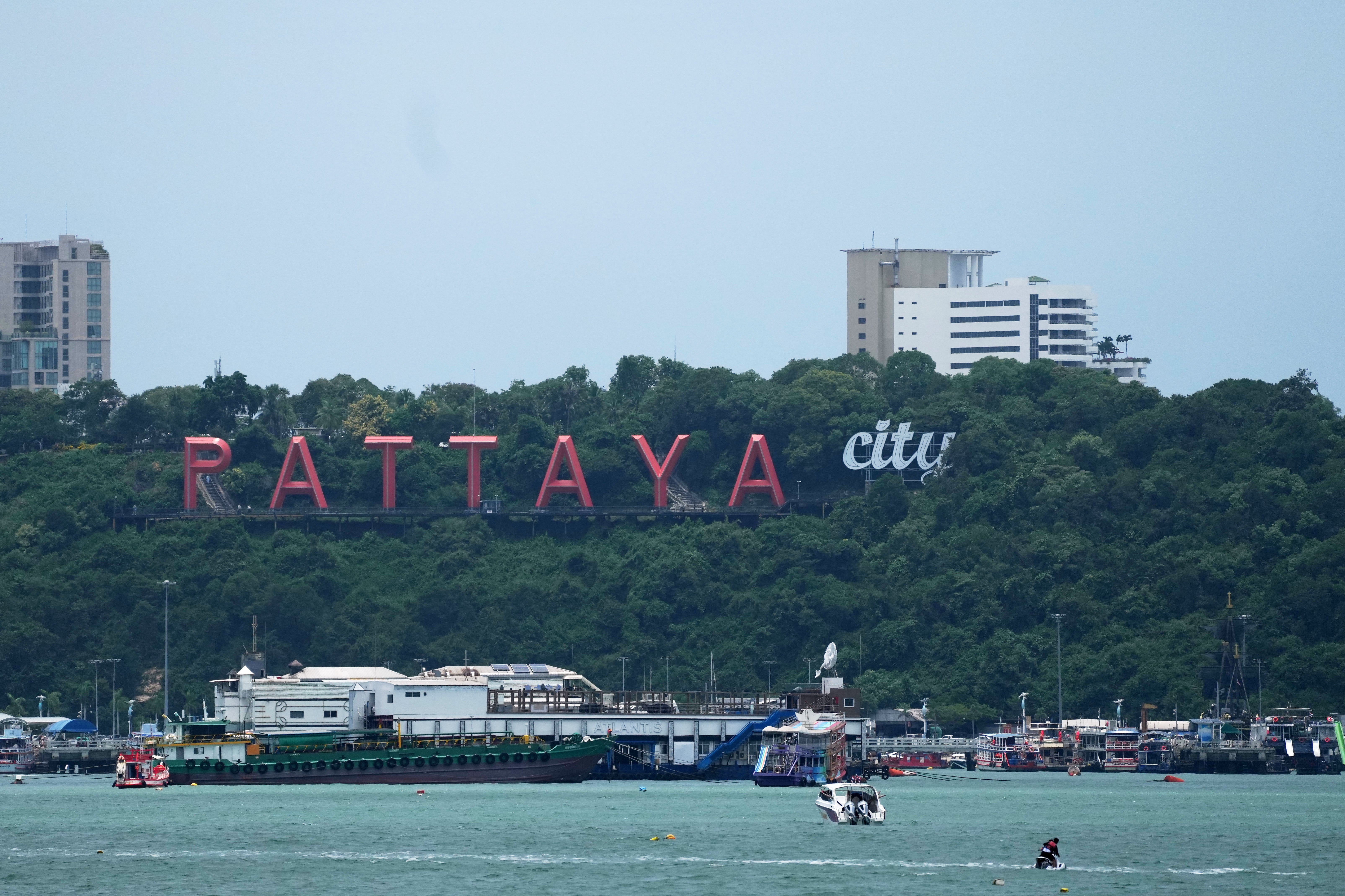 Tourists ride a jet ski on Pattaya Beach in Pattaya, Thailand, on Aug. 31, 2026. (AP Photo/Sakchai Lalit)
