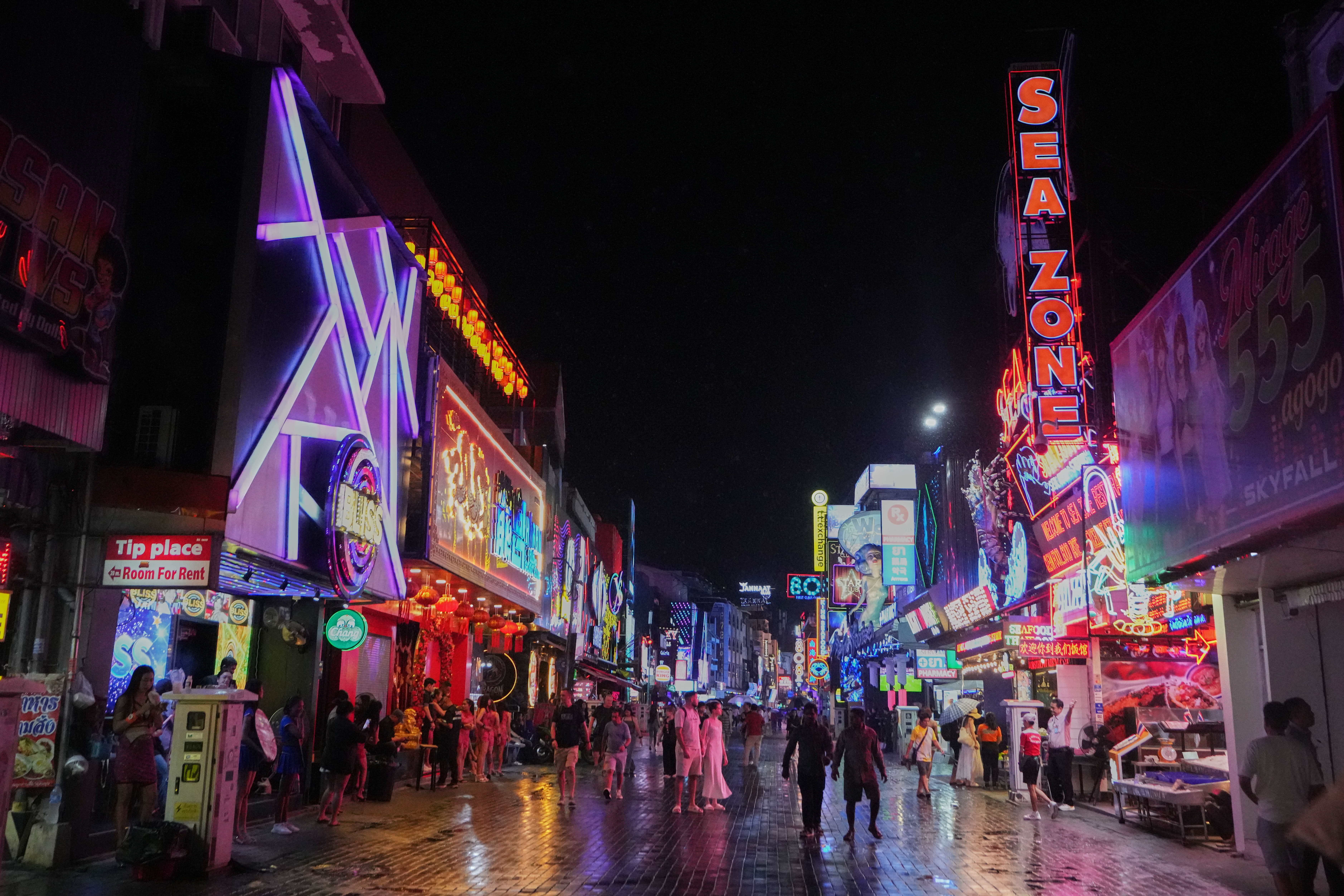 Tourists stroll down Walking Street in Pattaya, Thailand, on Aug. 31, 2026. (AP Photo/Sakchai Lalit)