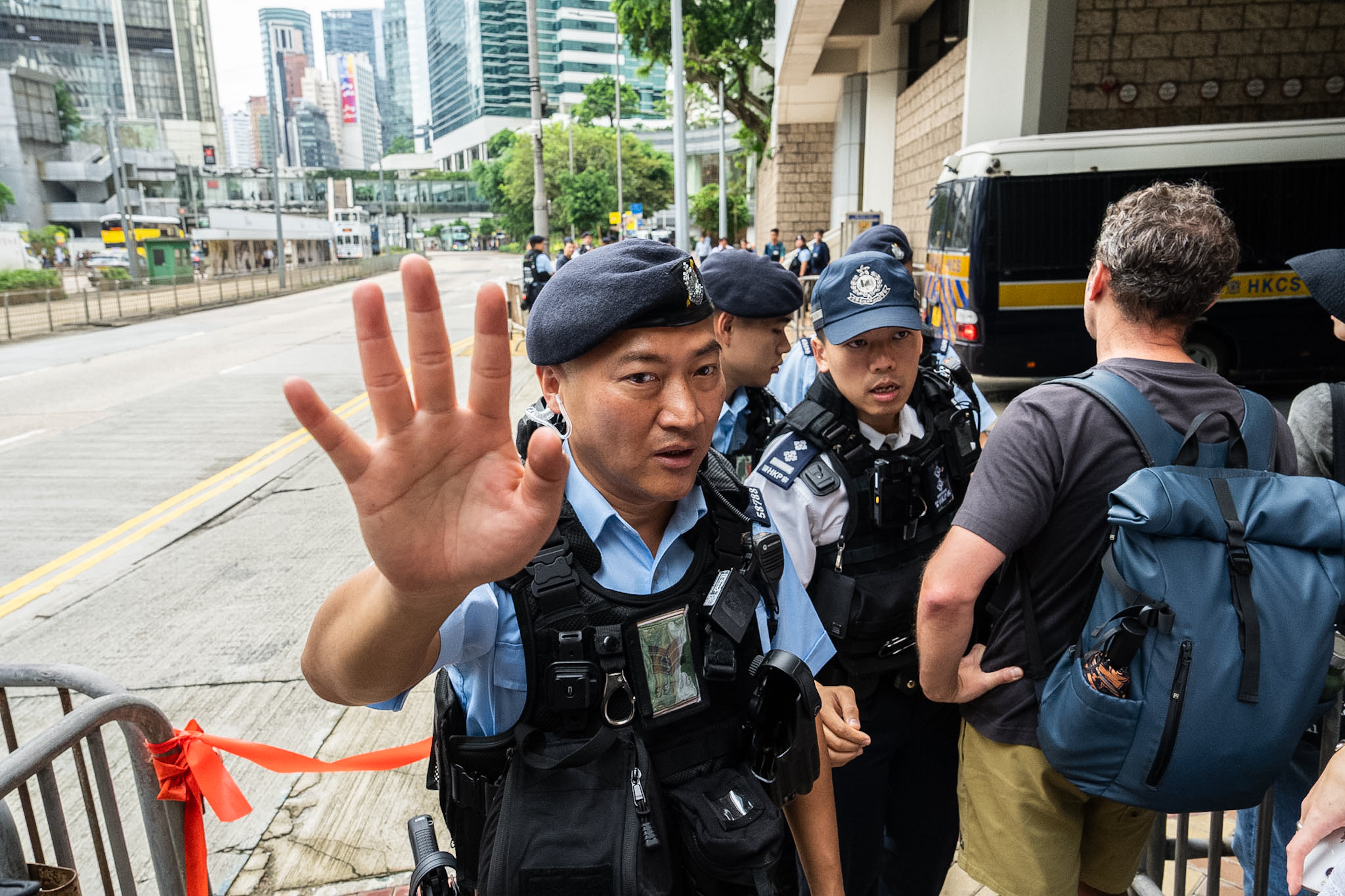 Police officers stand guard outside the High Court in Hong Kong, Wednesday (AP)