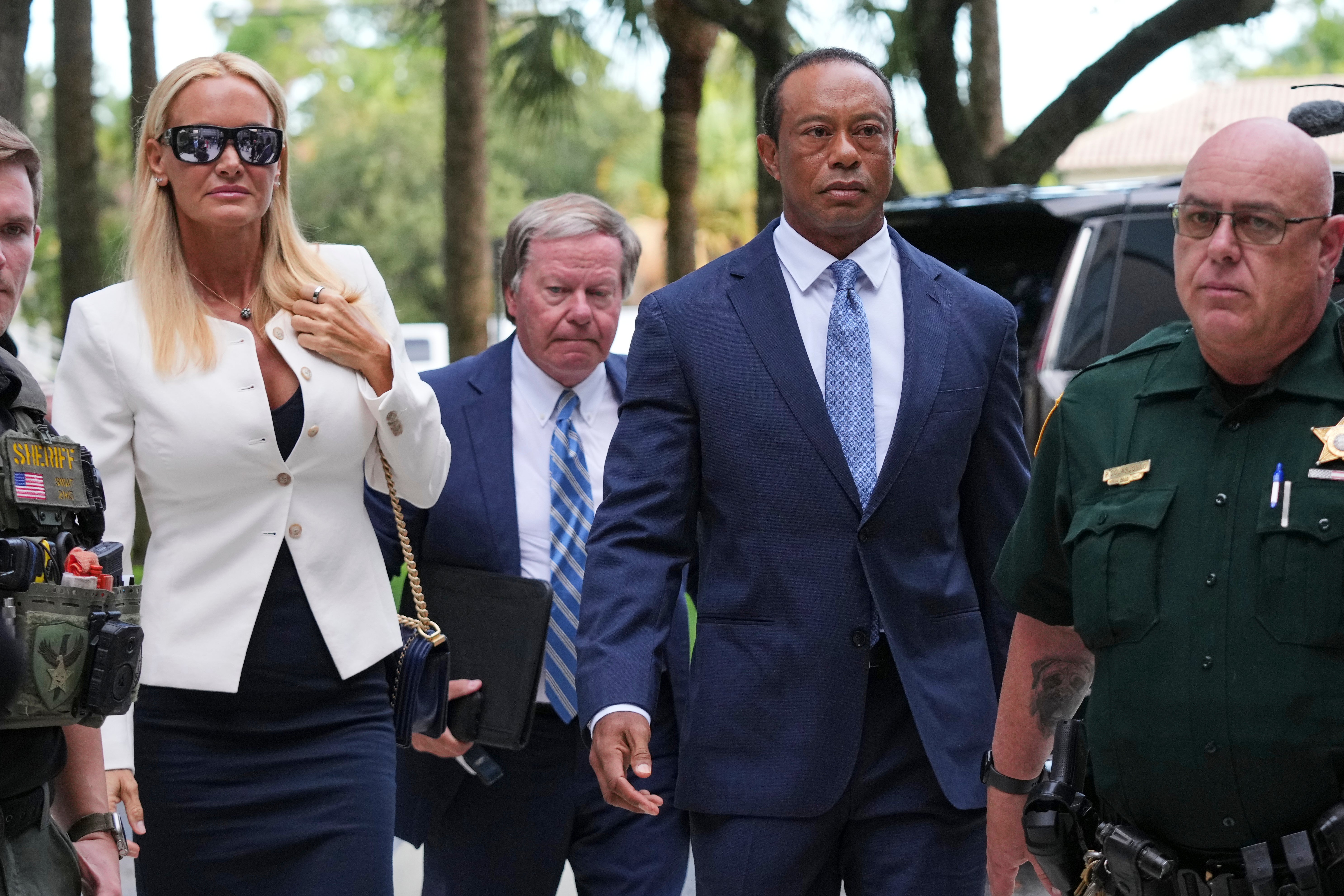 Tiger Woods arrives for his hearing accompanied by Vanessa Trump (Lynne Sladky/AP).