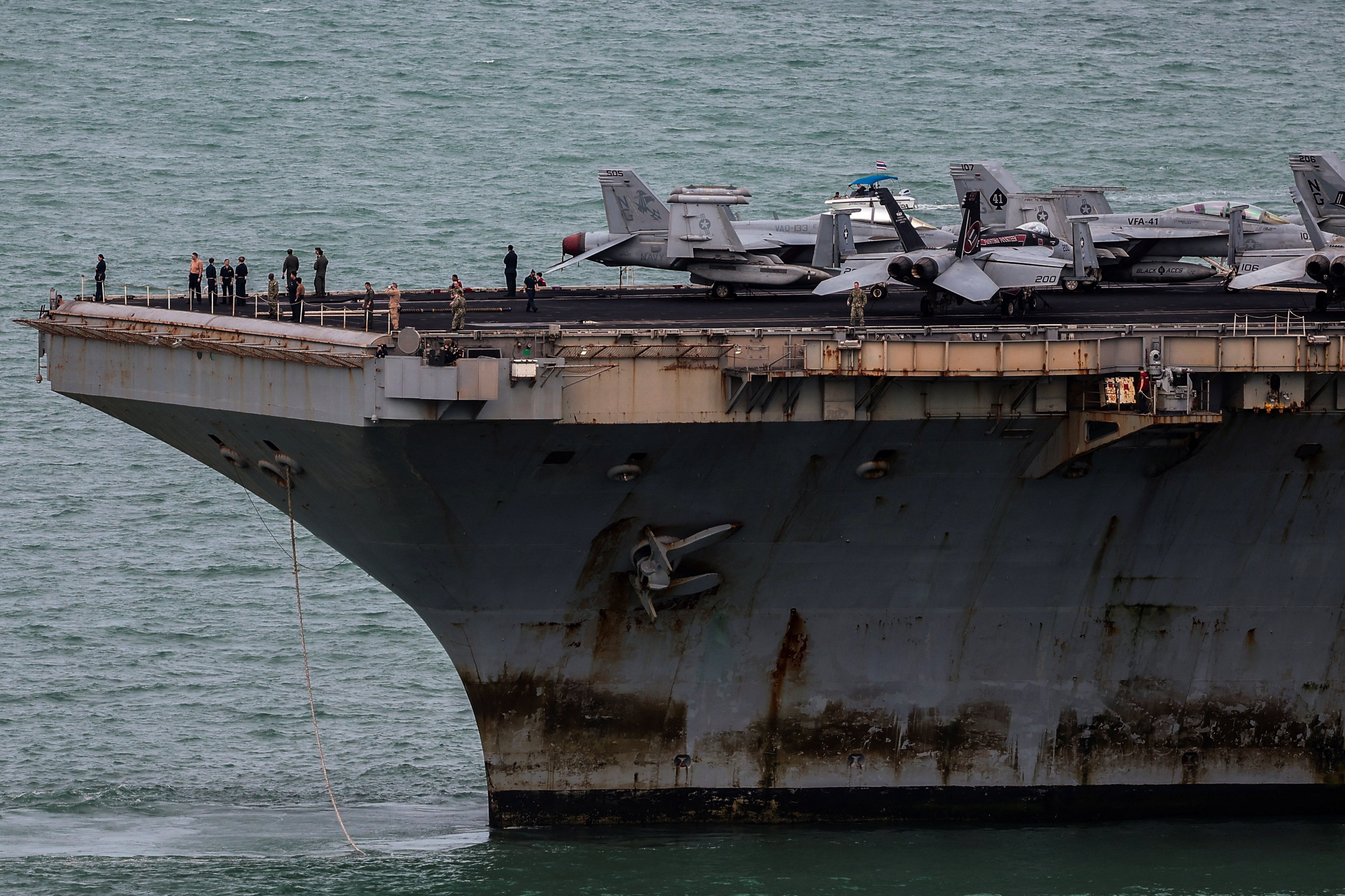 Rusted metal and chipped paint were clearly visible on the ship following its months-long deployment (Reuters)