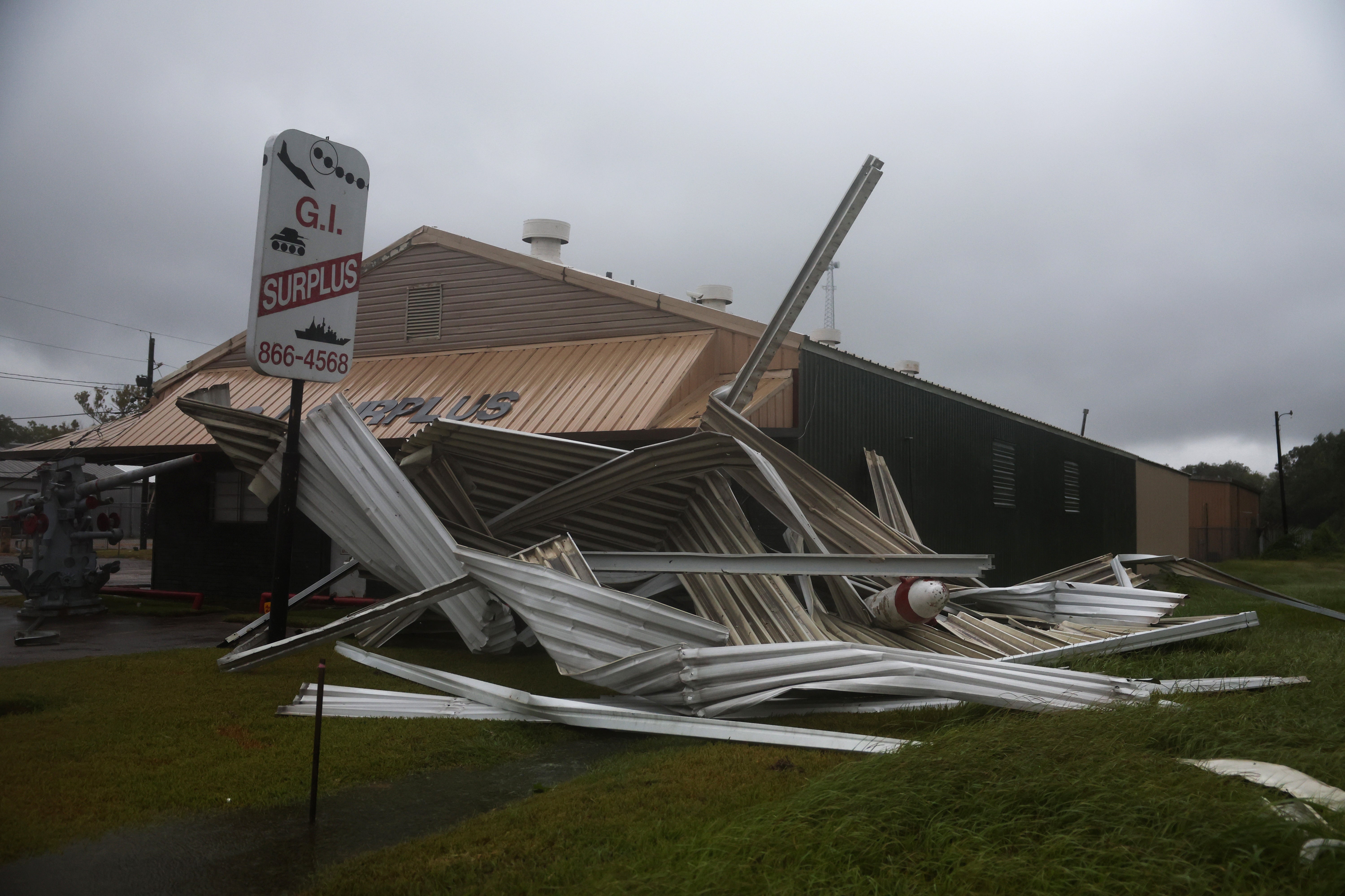 A damaged G.I. Surplus store is seen during Tropical Storm Edouard on Tuesday in Beaumont, Texas. Edouard is the fifth named storm of the Atlantic hurricane season
