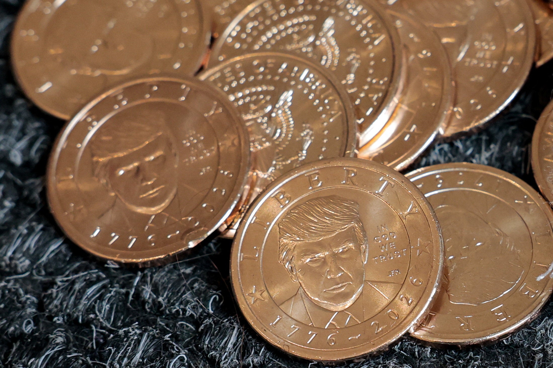 https://static.independent.co.uk/2026/09/02/19/2026-09-02T181628Z_356698591_RC24BNAD88ZU_RTRMADP_3_USA-TRUMP-COIN.JPG?trim=0,0,0,0&width=1200&height=800&crop=1200:800