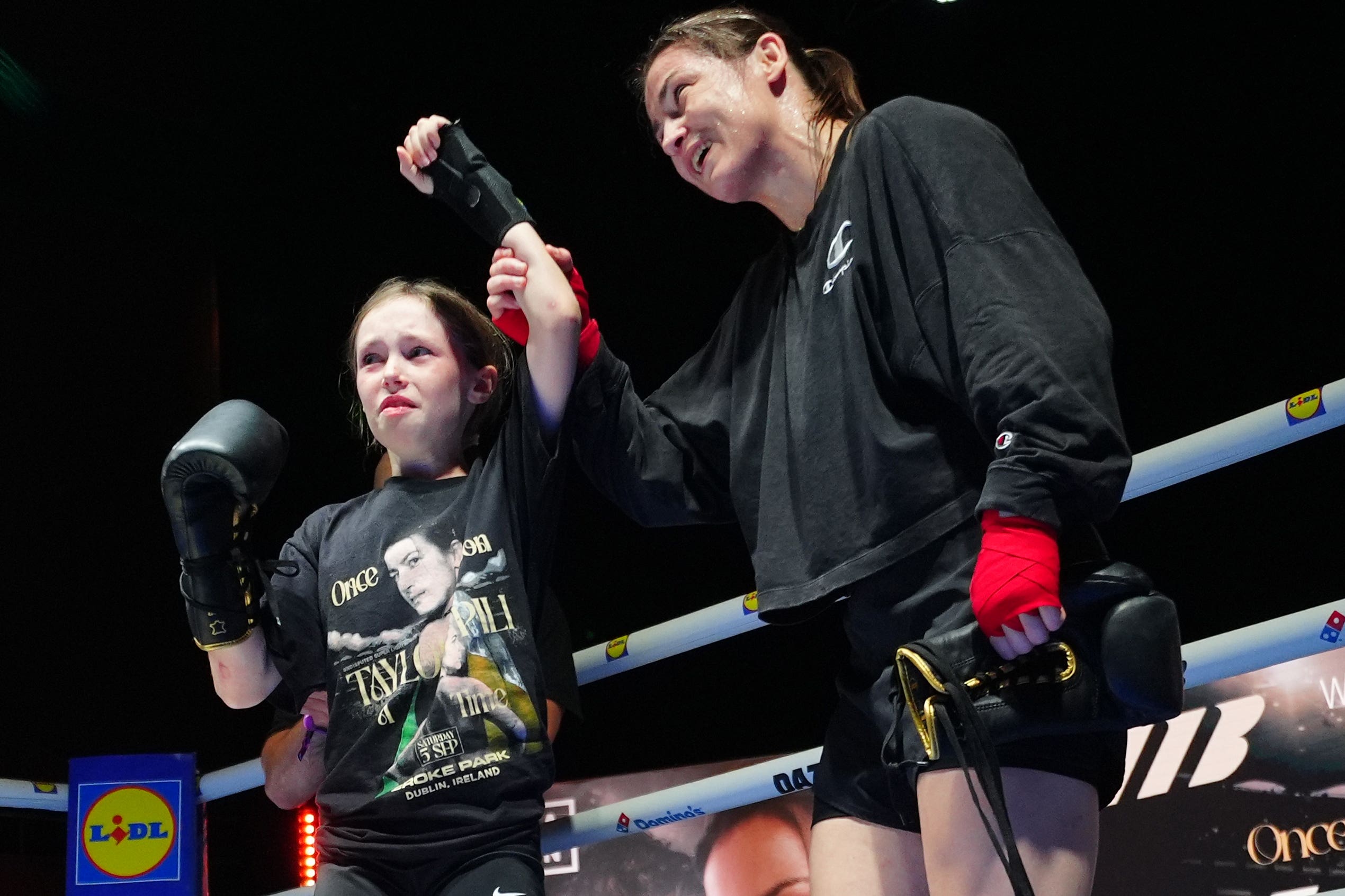 Katie Taylor with a young fan Clodagh Keating, aged 10, during an open workout
