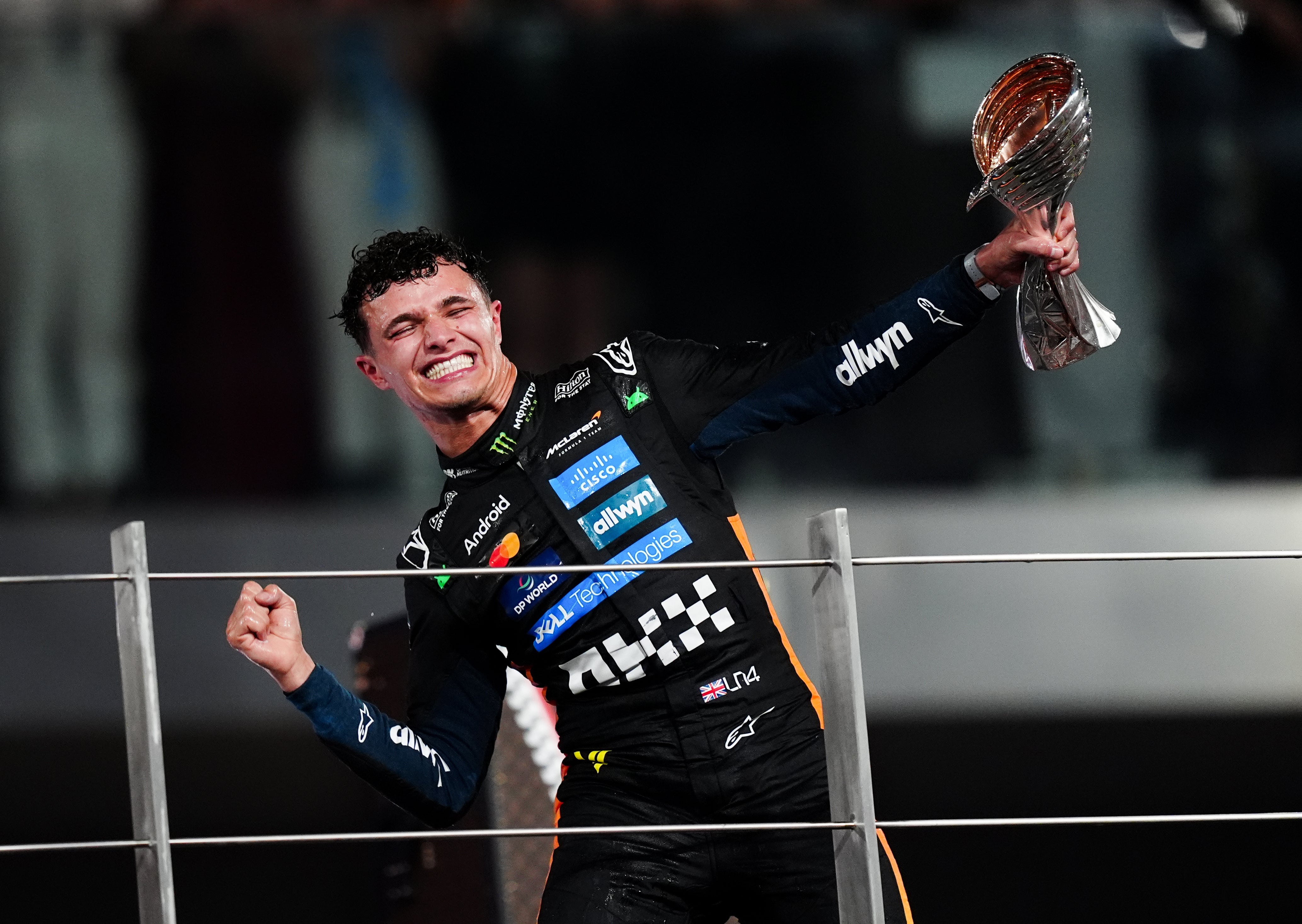 Norris celebrates winning the Formula One world championship (David Davies/PA)