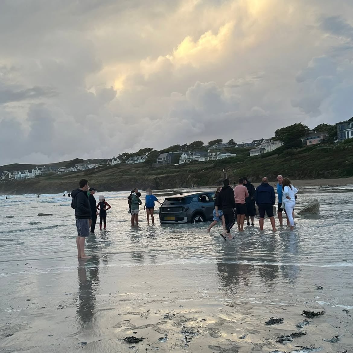 Tourist’s electric car almost swept out to sea on UK beach