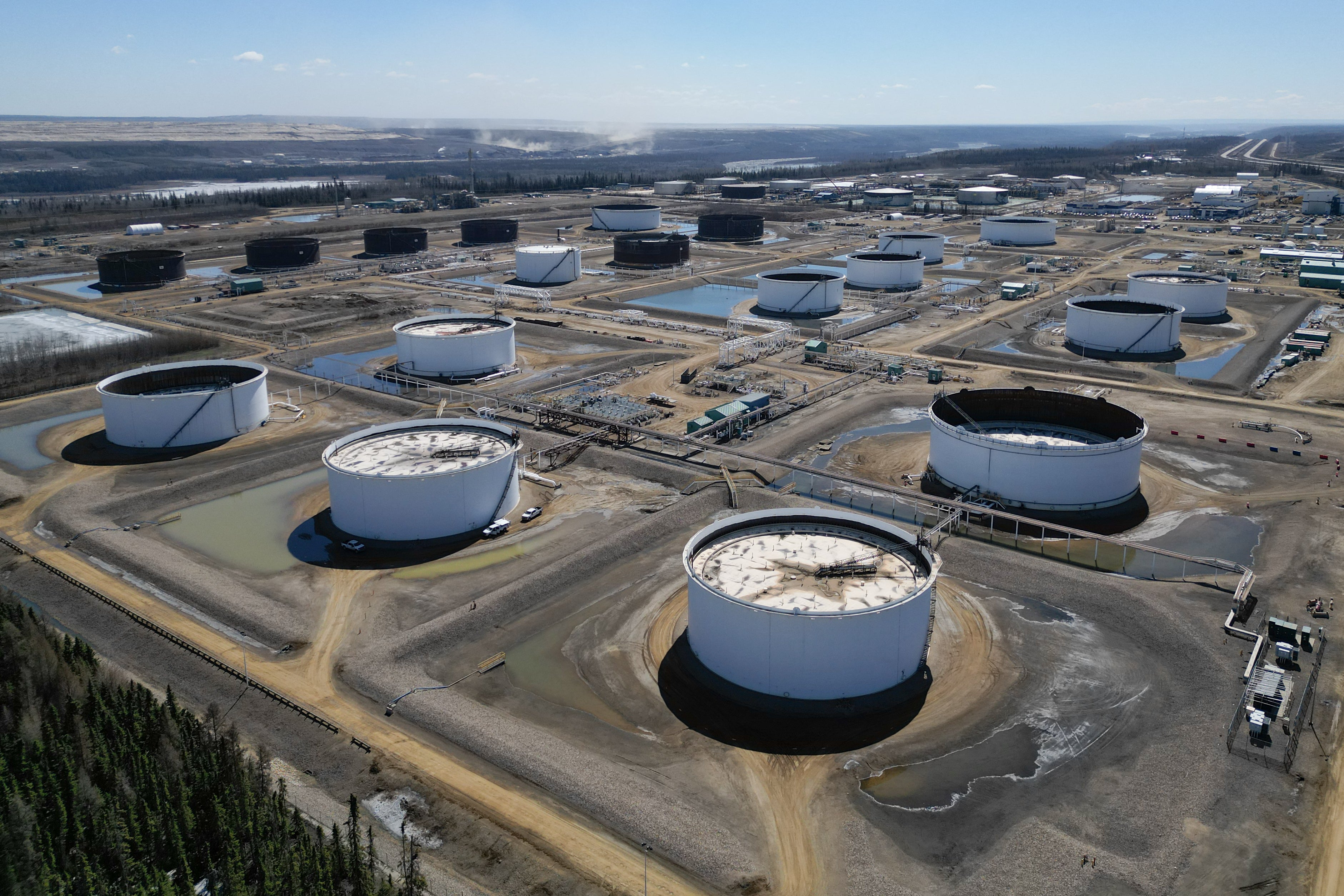 An aerial view of oil storage tanks at Fort McMurray in Alberta, Canada, on May 5, 2026. Canadian officials acknowledge significant leverage against Donald Trump in the burgeoning trade war, but weaponizing oil and gas levies could be potentially devastating for both economies