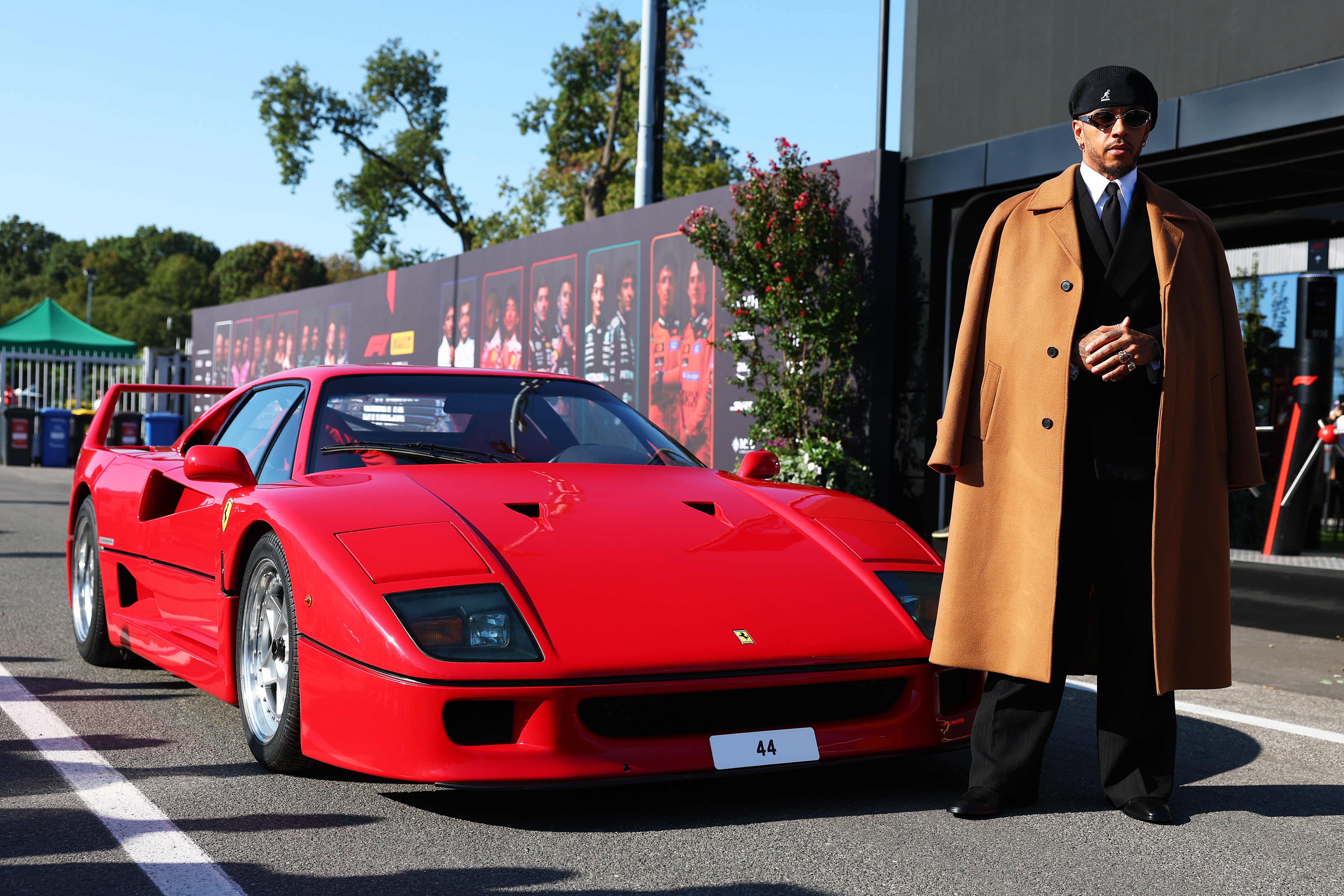 Hamilton poses next to his F40 car outside the Monza paddock (Getty)