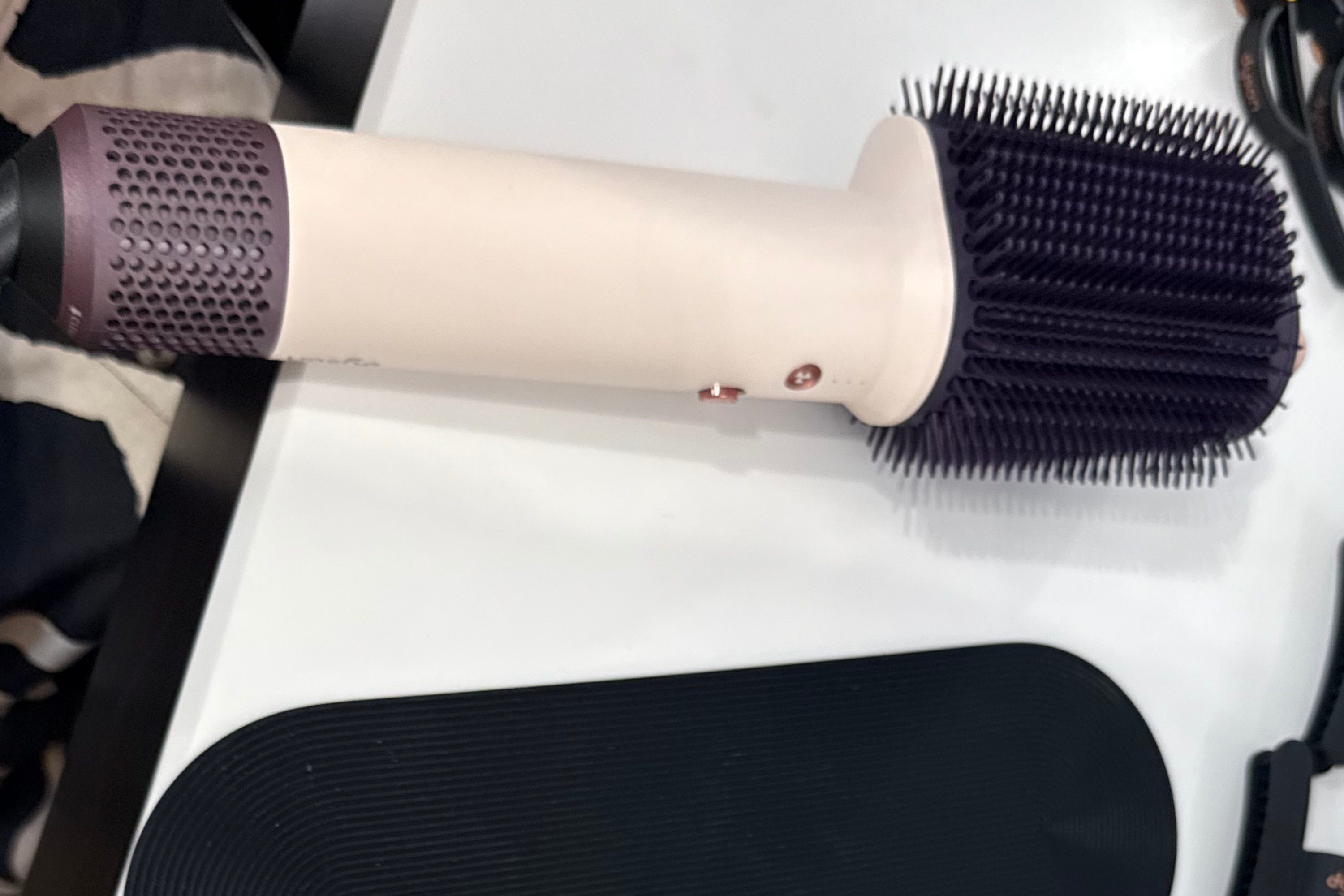 Compared with the airwrap, the brush head on the airsmooth is a permanent fixture