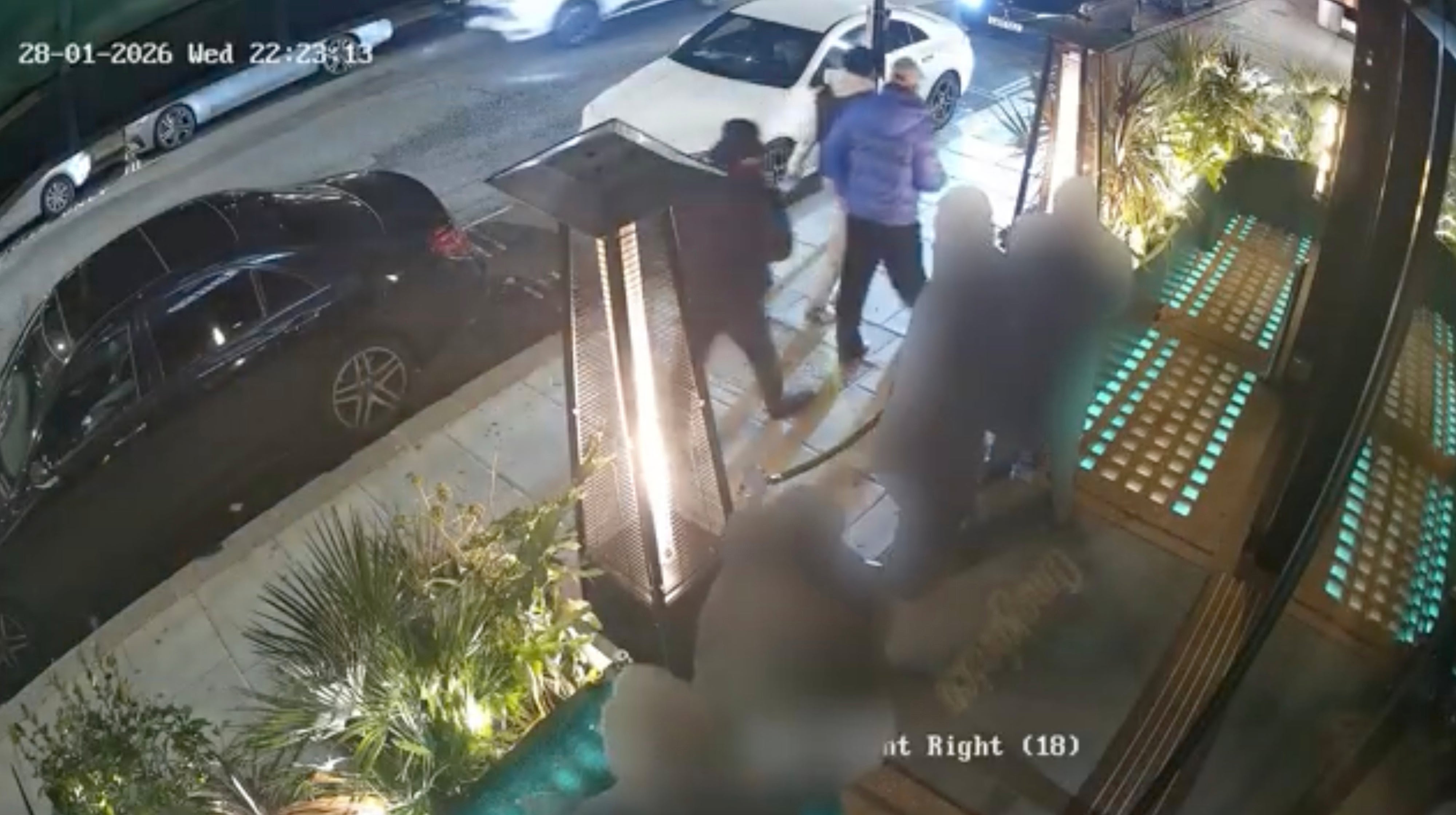 The court was shown footage of the robbers watching him earlier in the evening as he stood in the smoking area of the restauran