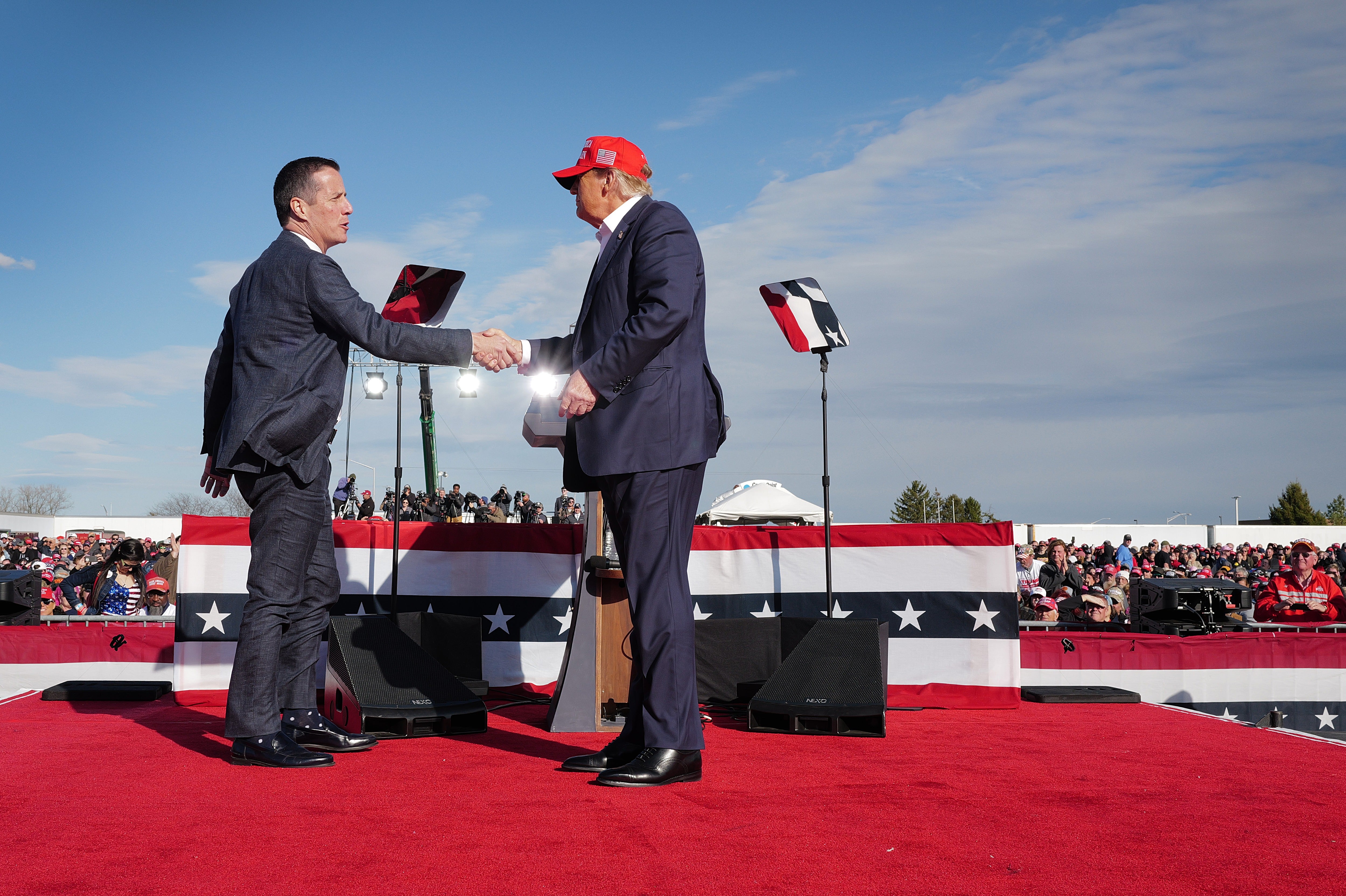 Trump campaigns on behalf of then-Ohio Senate candidate Bernie Moreno near Dayton International Airport on March 16, 2024 – a cold day on which, contrary to his recollections, he wore a baseball cap