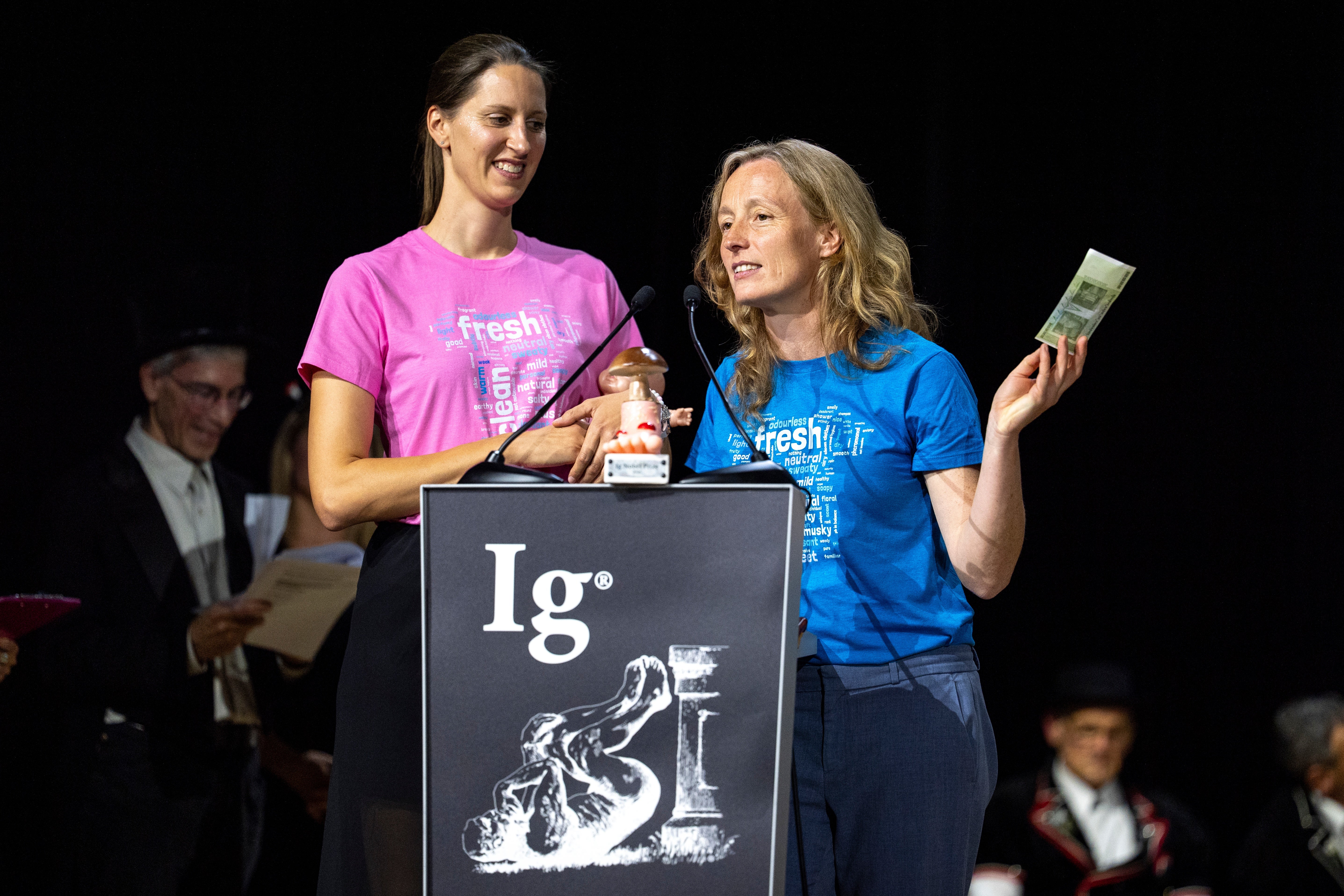 Ig Nobel Prize winners Agnieszka Sorokowska, left, and Ilona Croy speak during the awards ceremony in Zurich