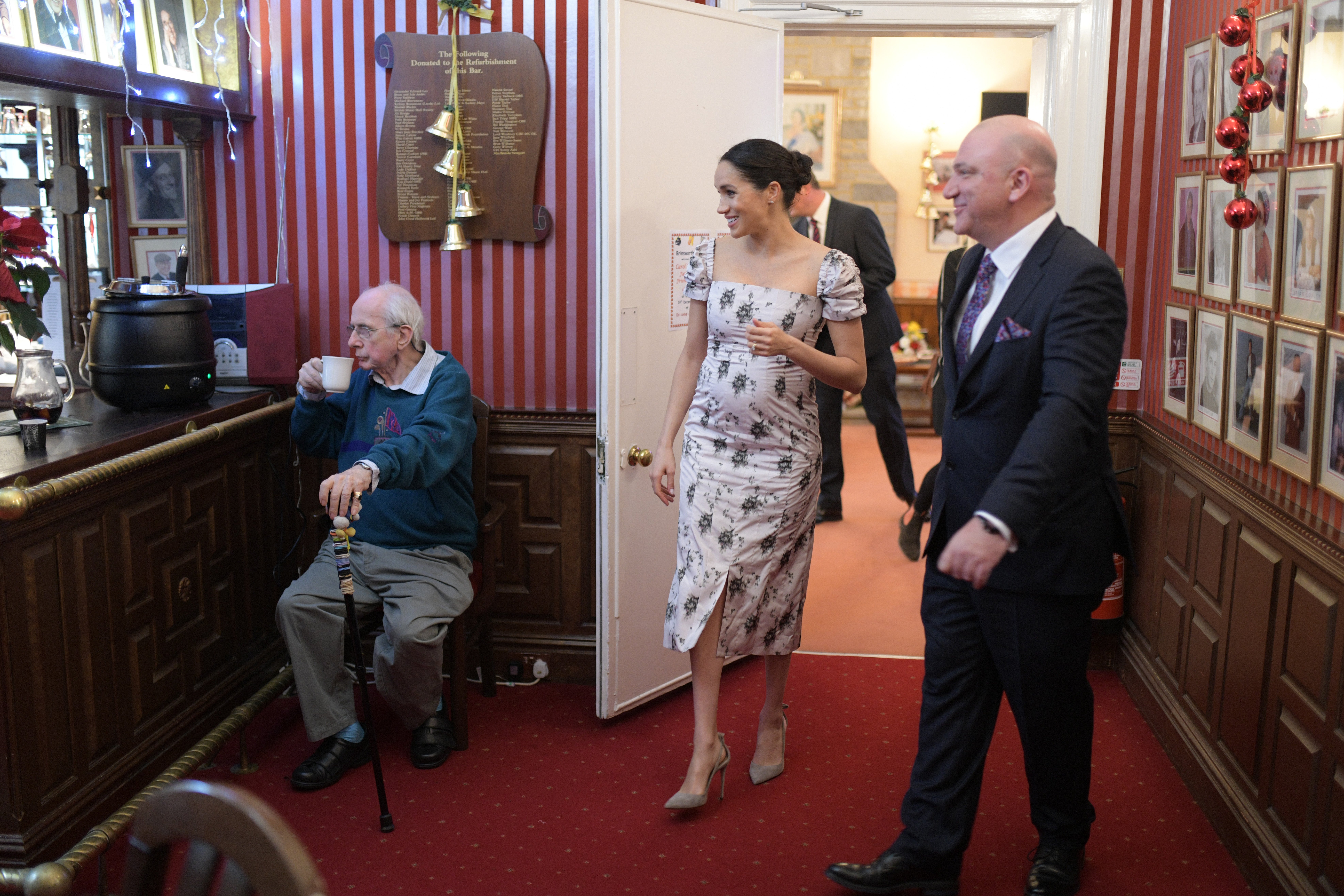 The Duchess of Sussex meets Richard O'Sullivan during a visit to the Royal Variety Charity's residential nursing and care home, Brinsworth House (PA)