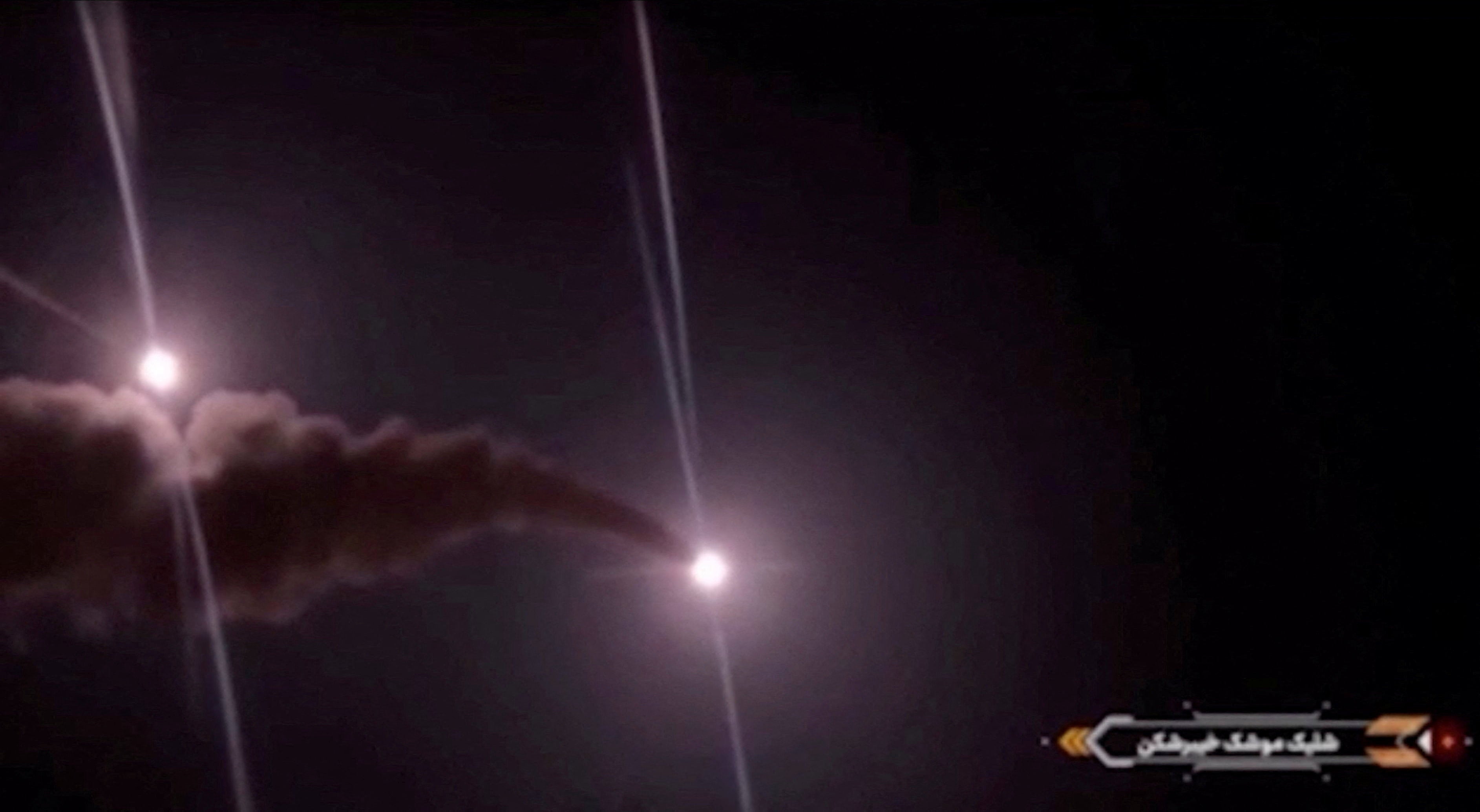 Projectiles streak across the sky in this screengrab taken from footage published by Iranian authorities purporting to show missiles launched at US military targets in Jordan from an unknown location, released on August 31, 2026