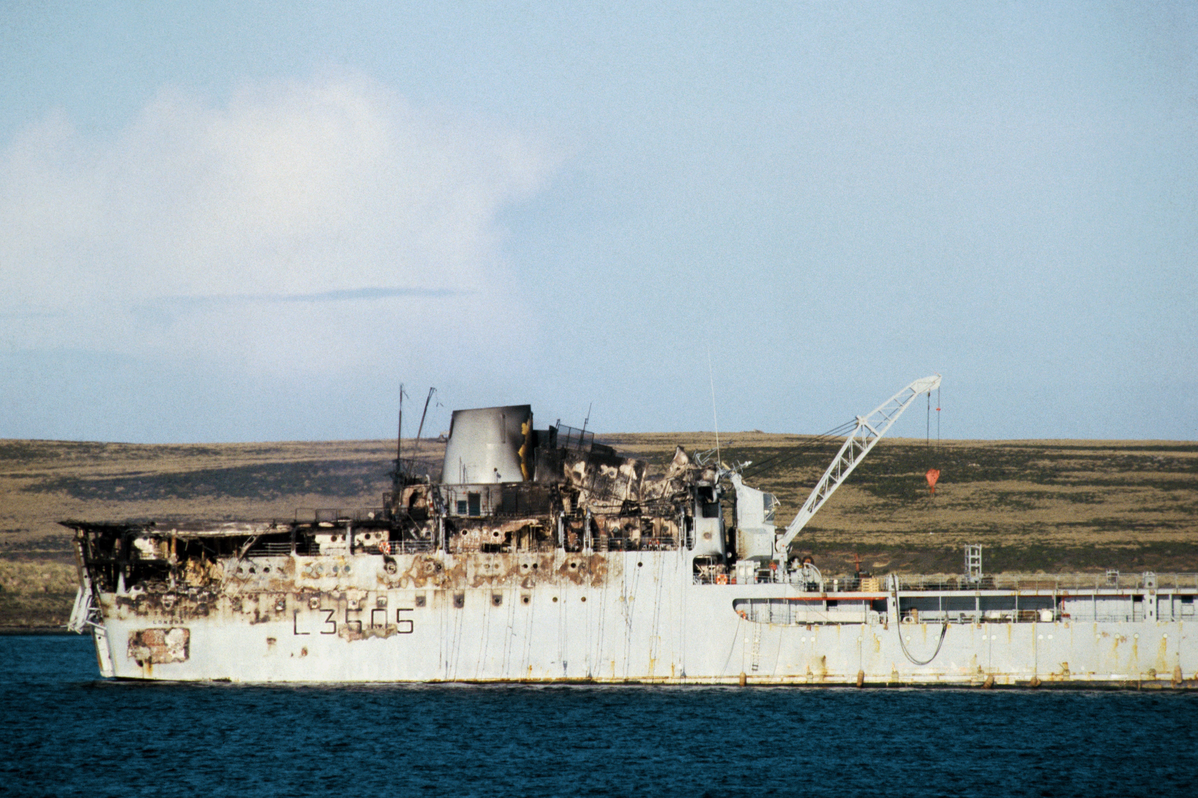 The damaged supply ship Sir Tristram lying of Bluff Cove in the Falklands after the Argentine air attack that led to the sinking of her sister ship, the Sir Galahad. June 1, 1982