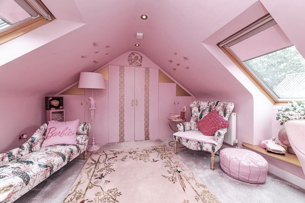 The bedrooms, hallway and living area are all pink