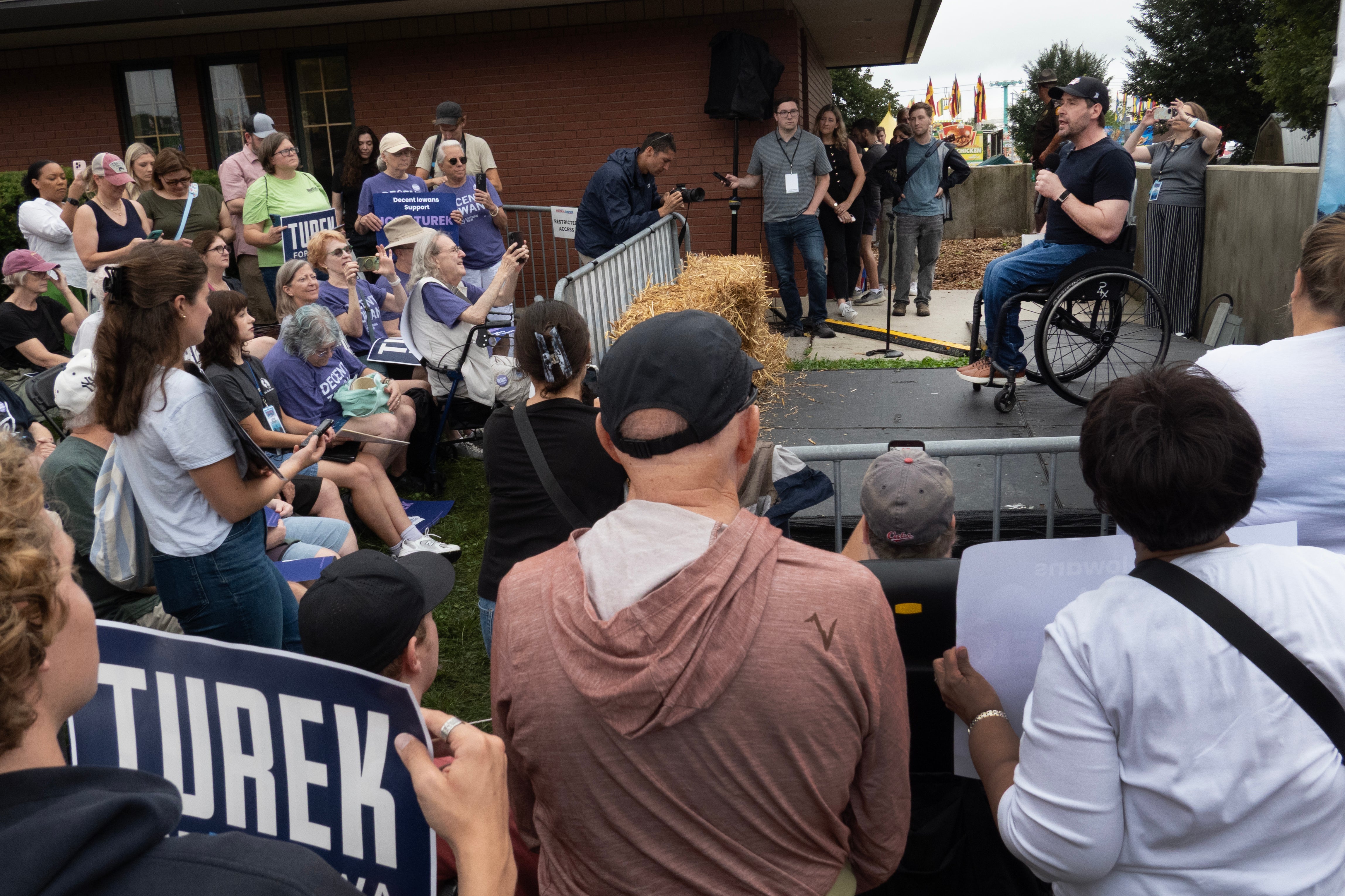 Democratic nominee for the U.S. Senate Josh Turek speaks to fairgoers at the Iowa State Fair - a blue win in a red state would be a big statement for the Demcorats