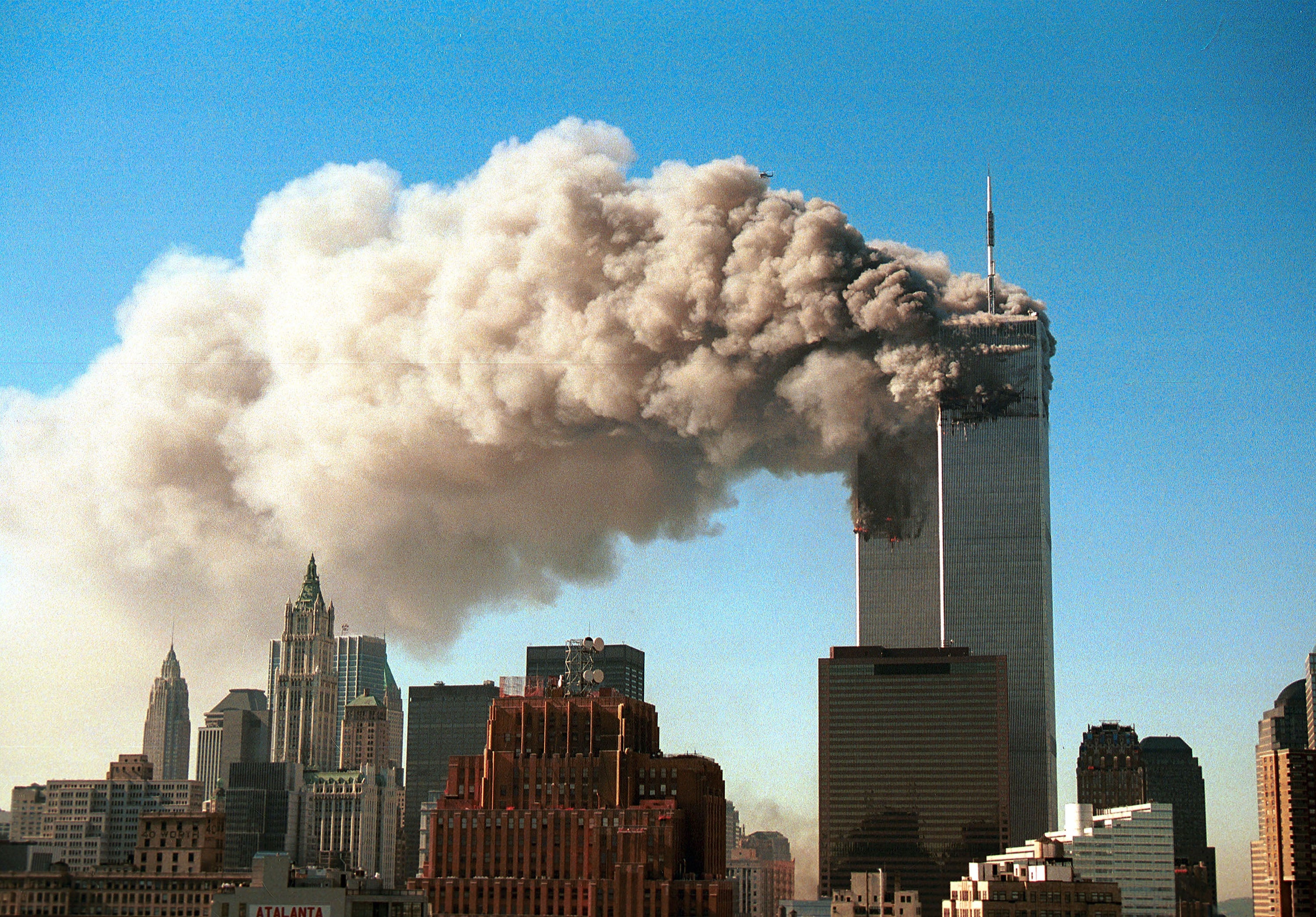 Smoke pours from the World Trade Center after it was hit by two hijacked passenger planes September 11, 2001 in New York City
