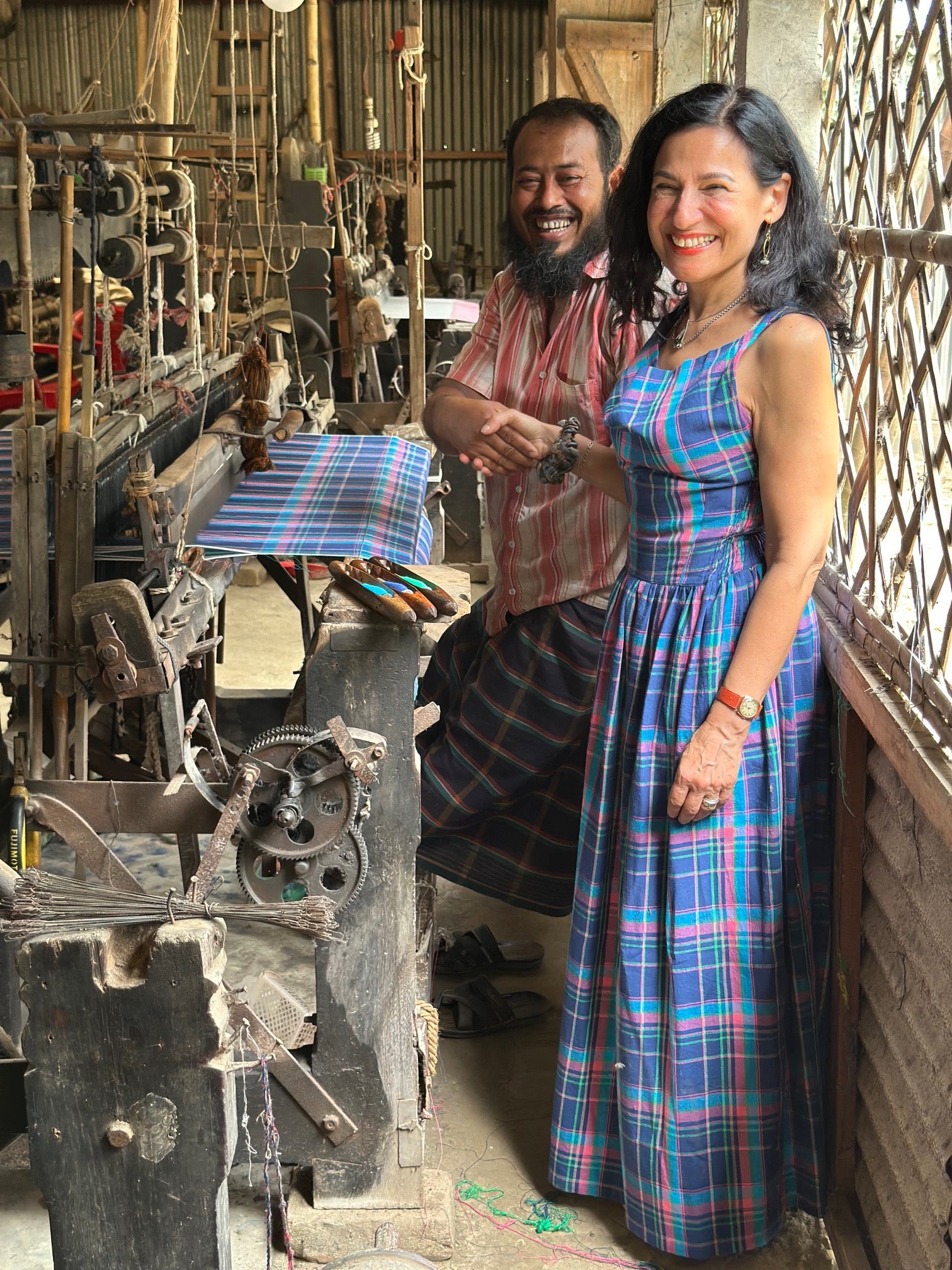 Safia Minney with a handweaver at Swallows in Bangladesh, where traditional skills are used to create fabric for Indilisi and support dignified, lower-impact livelihoods.