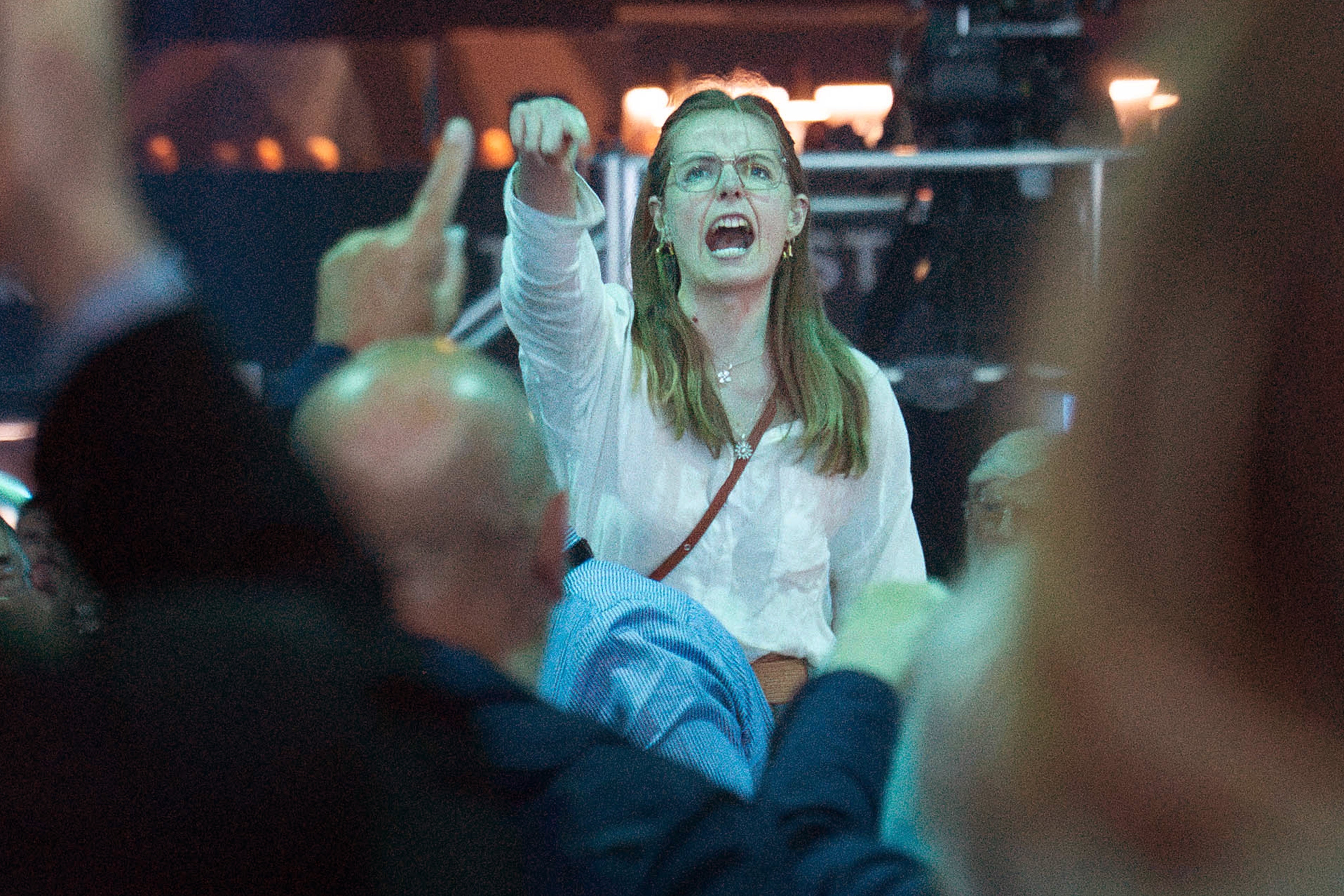 A demonstrator shouts while Reform UK leader Nigel Farage delivers a keynote speech (Stefan Rousseau/PA) (PA Wire)