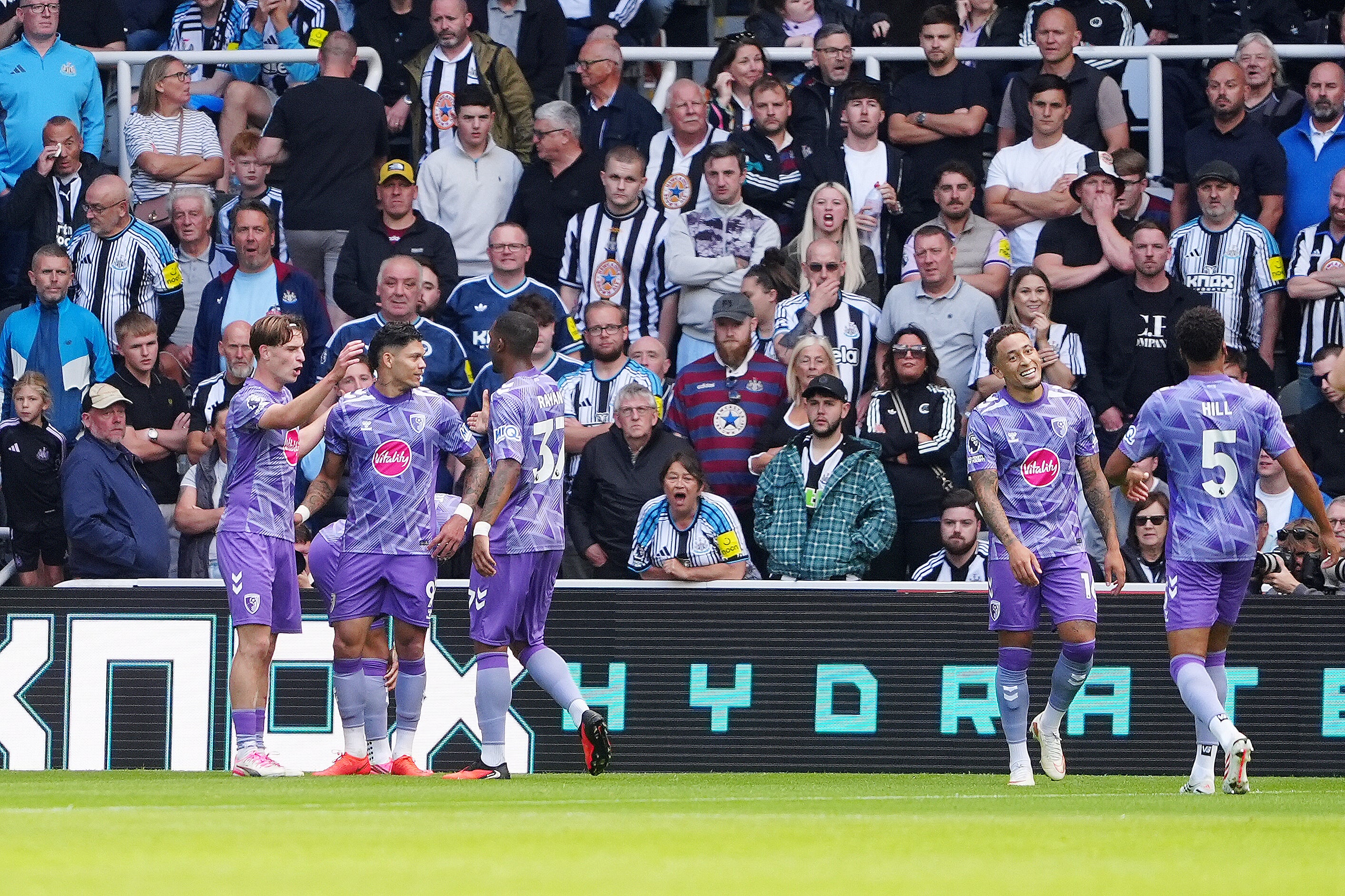 Bournemouth's Alex Scott (left) celebrates with team-mates after Newcastle United's Malick Thiaw scored an own goal