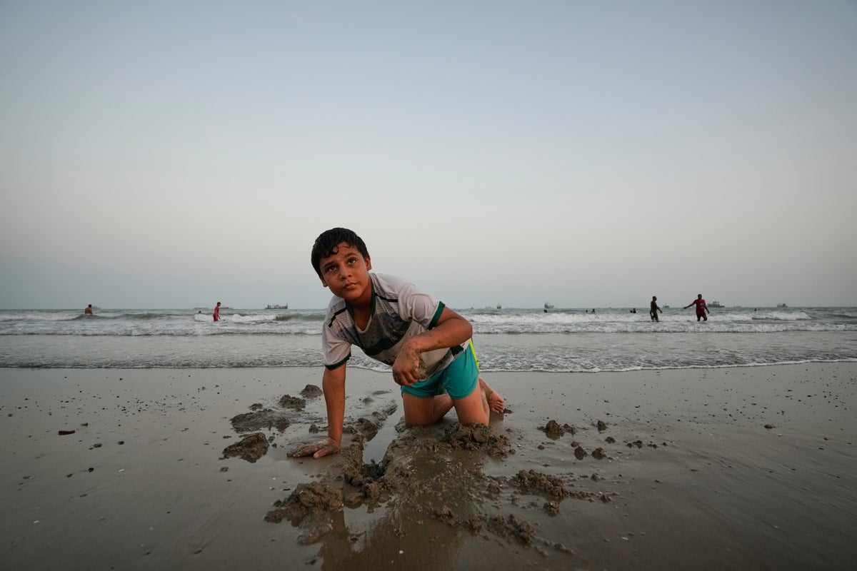 Daily life continues in the Iranian coastal community of Kuhestak