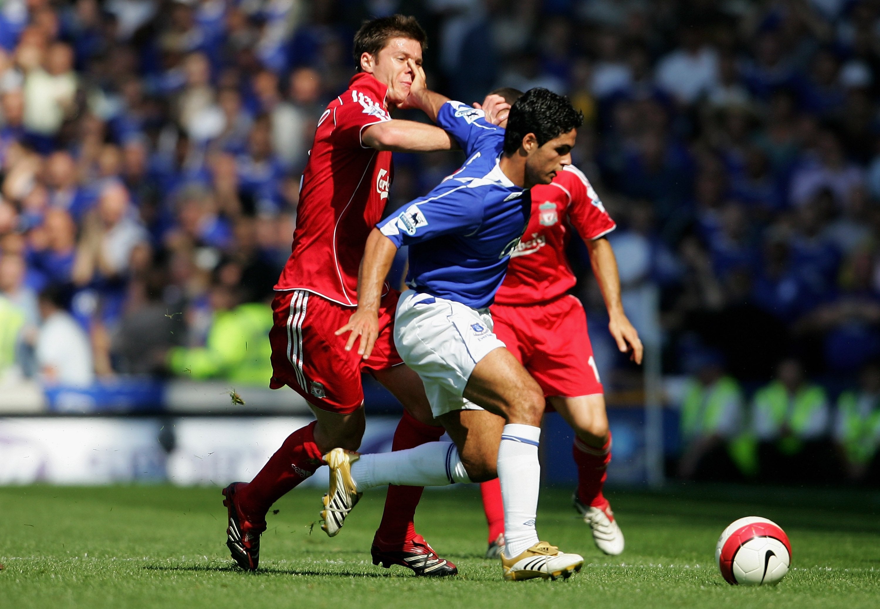 Mikel Arteta holds off Xabi Alonso during a Merseyside derby at Goodison Park in 2006