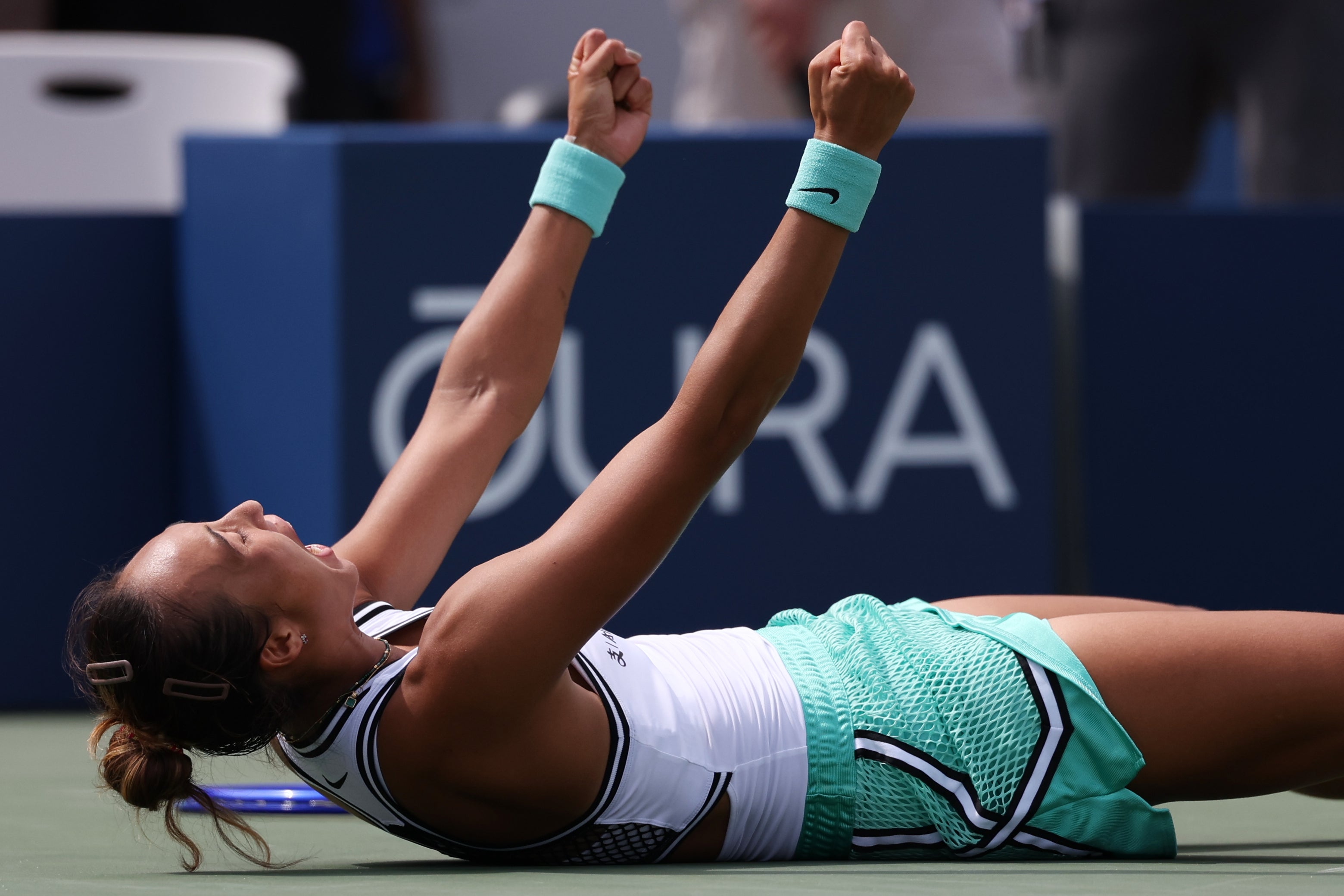Zheng dropped to the court in joy as she overcame Keys