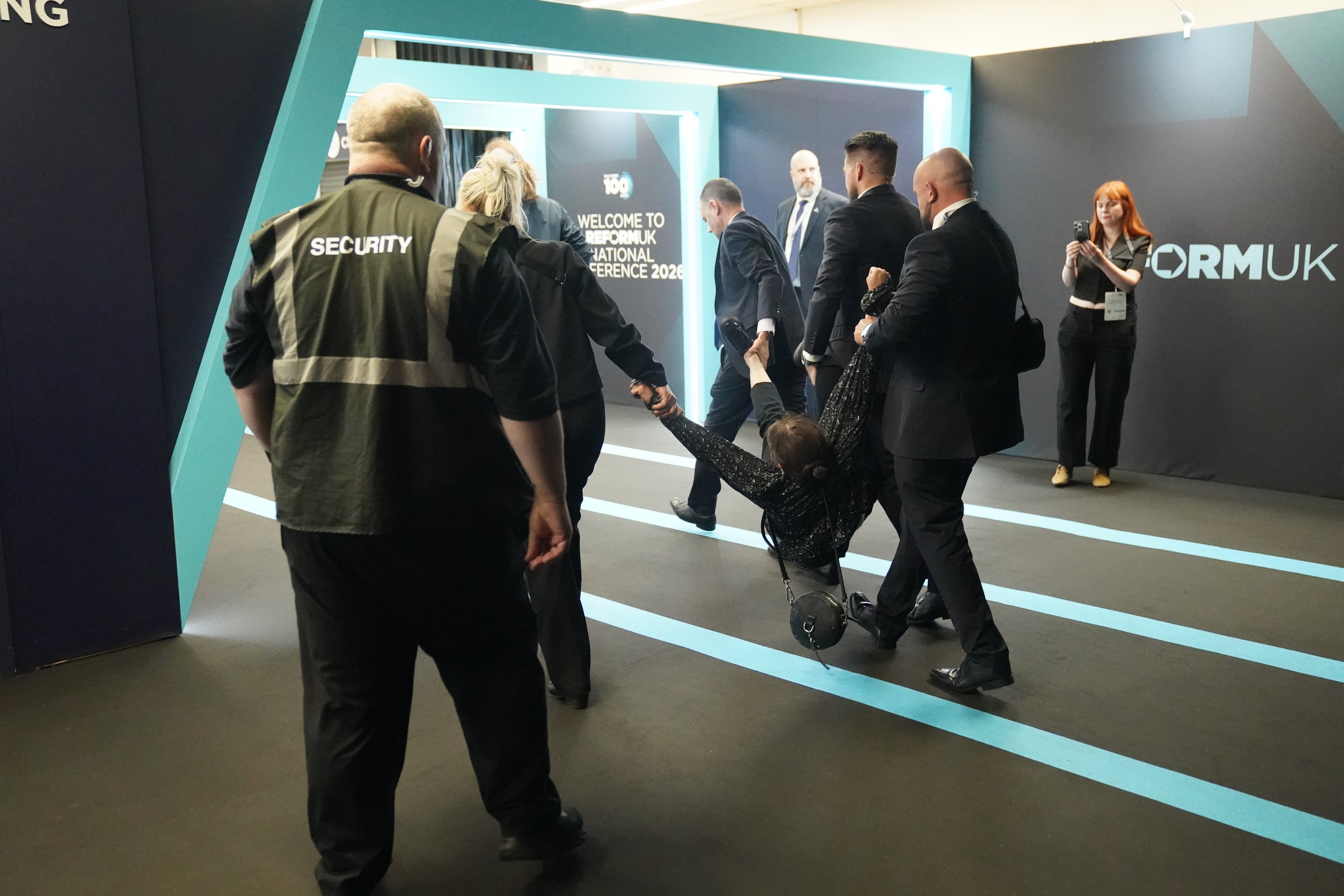 Video emerged of a woman having her hair pulled by audience members at Reform UK’s conference (PA Wire)