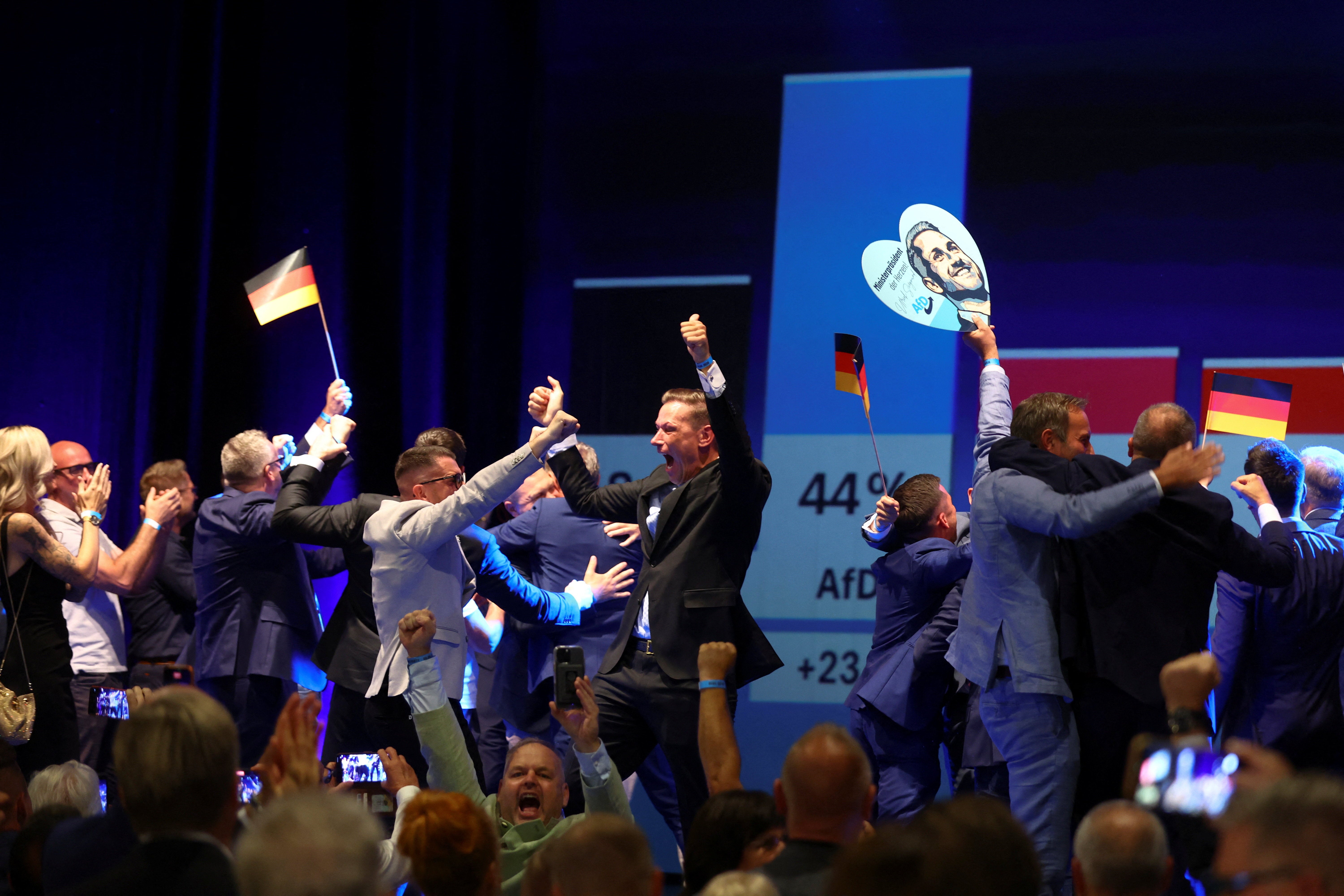 AfD supporters celebrate after polls closed in the Saxony-Anhalt state elections, in Magdeburg, Germany