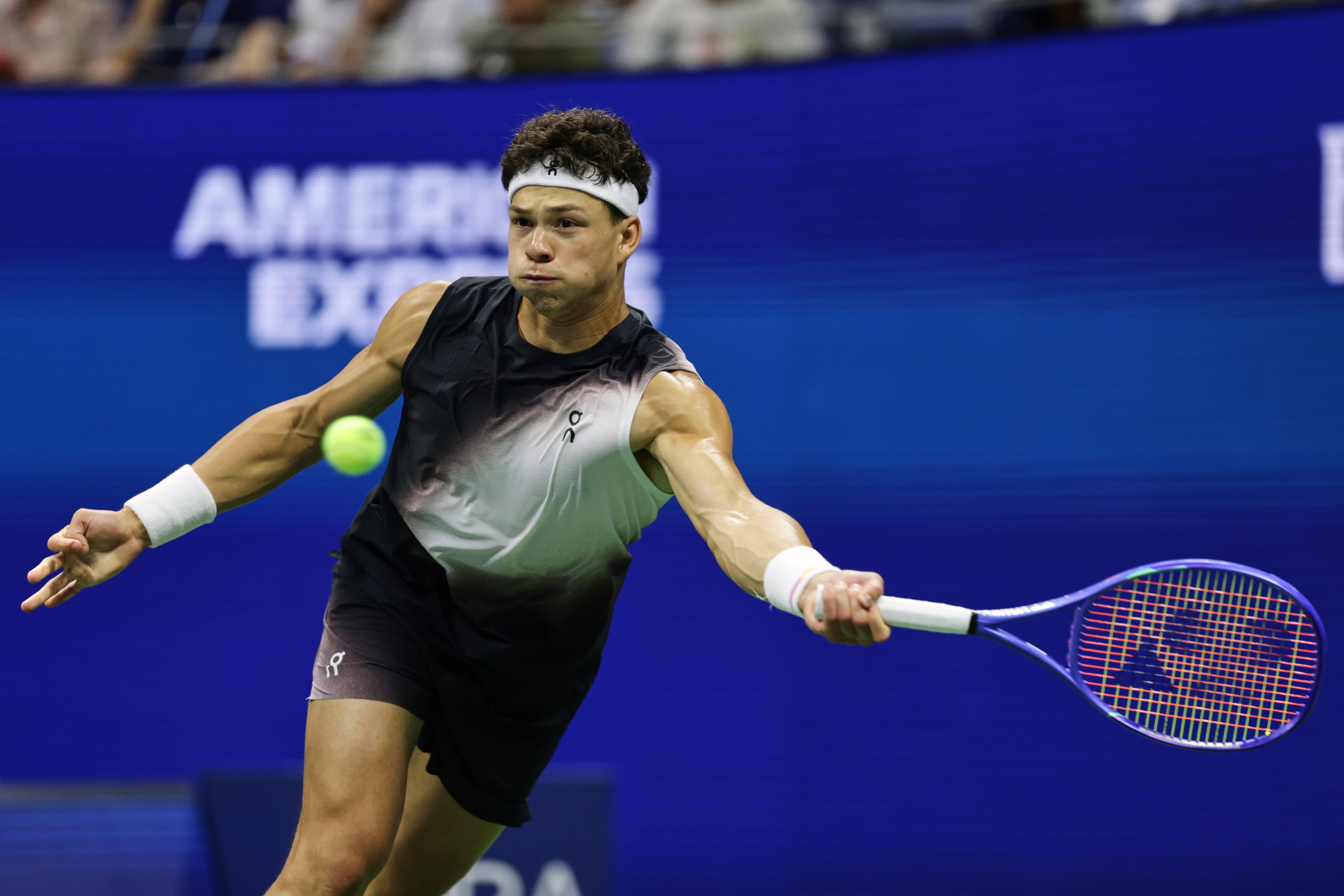 Ben Shelton returns against Stefanos Tsitsipas (Adam Hunger/AP)