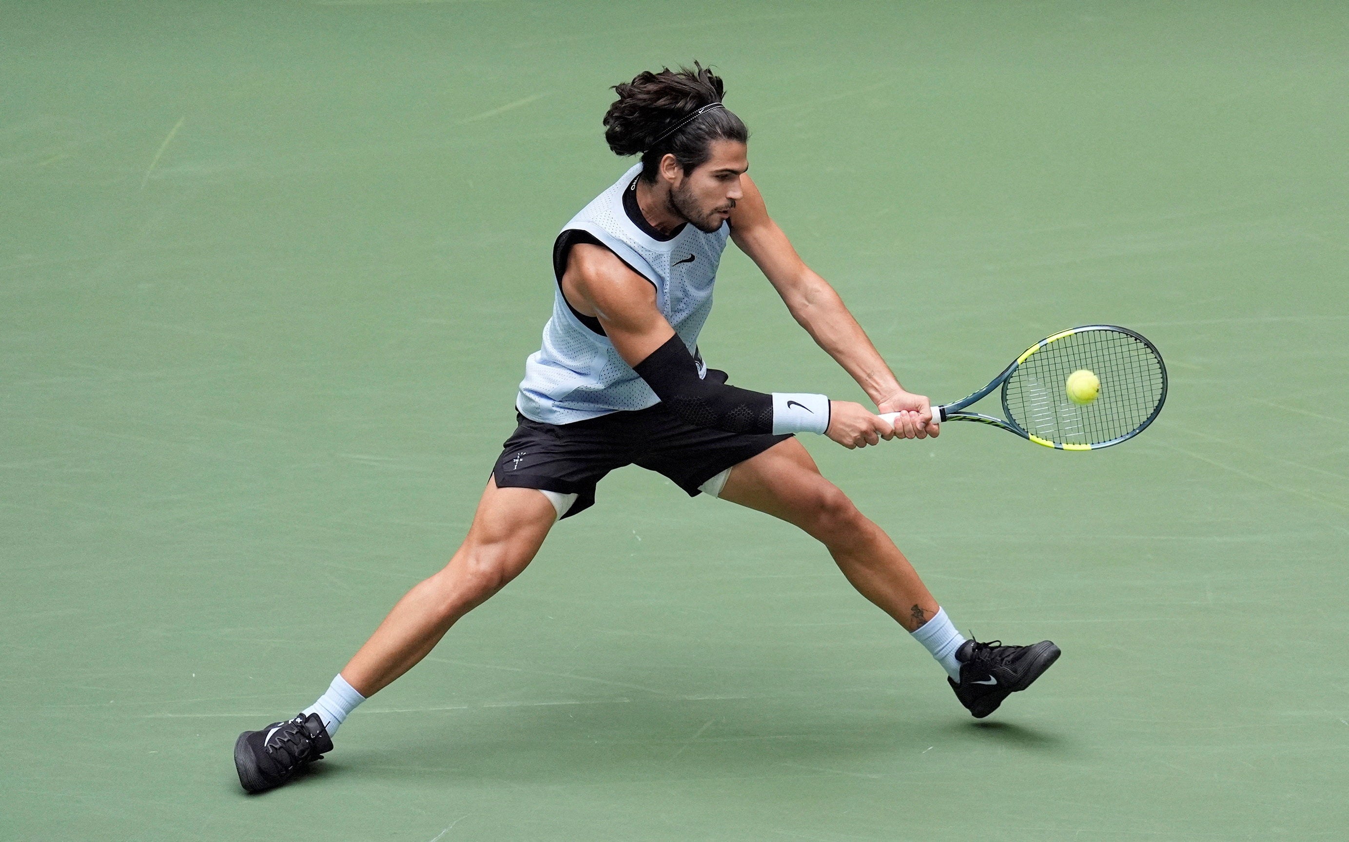Carlos Alcaraz in action during his round of 16 match against Tommy Paul