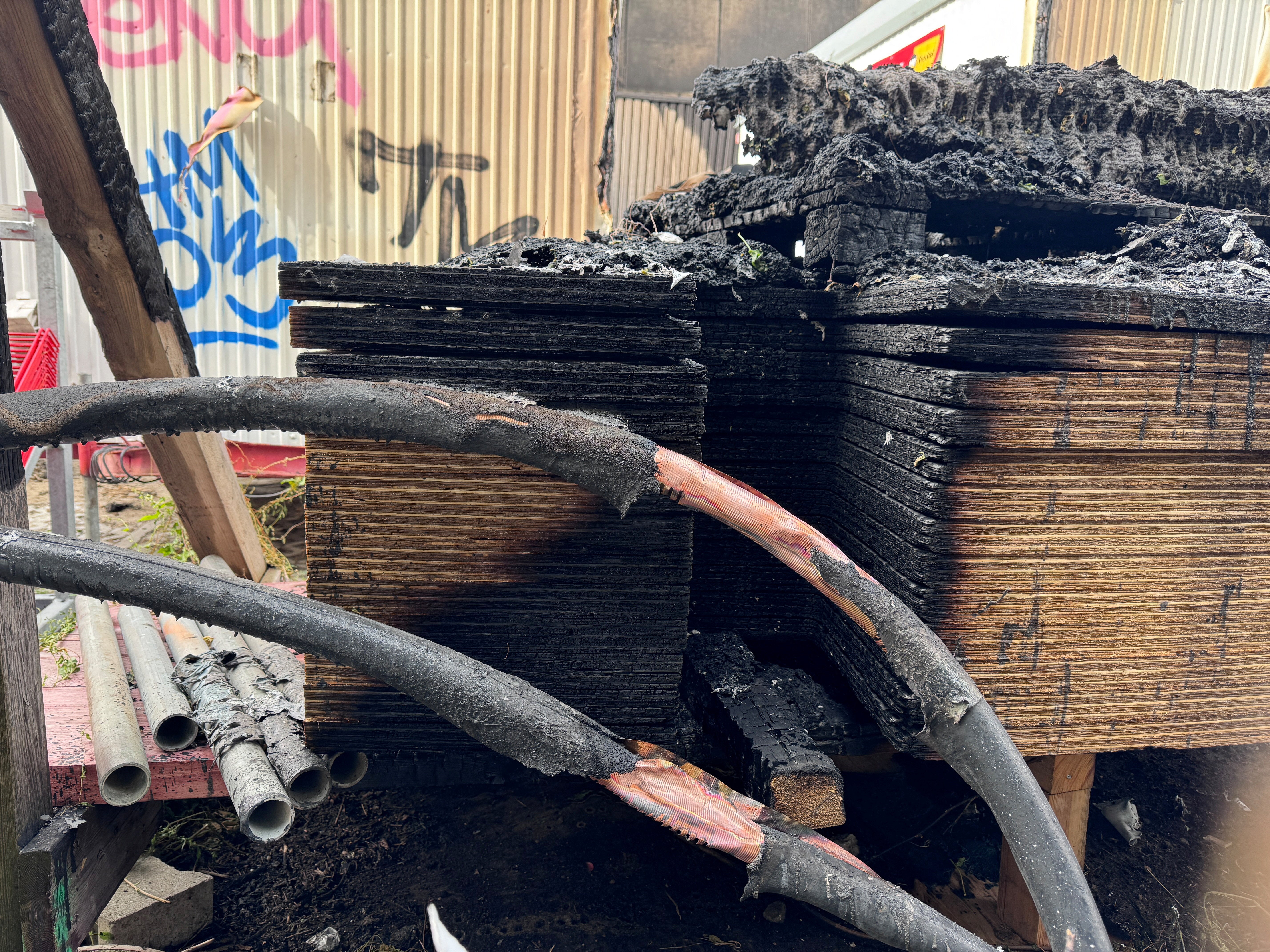 Burned building materials at the construction site in Berlin on Monday, in the aftermath of the fire (Reuters)