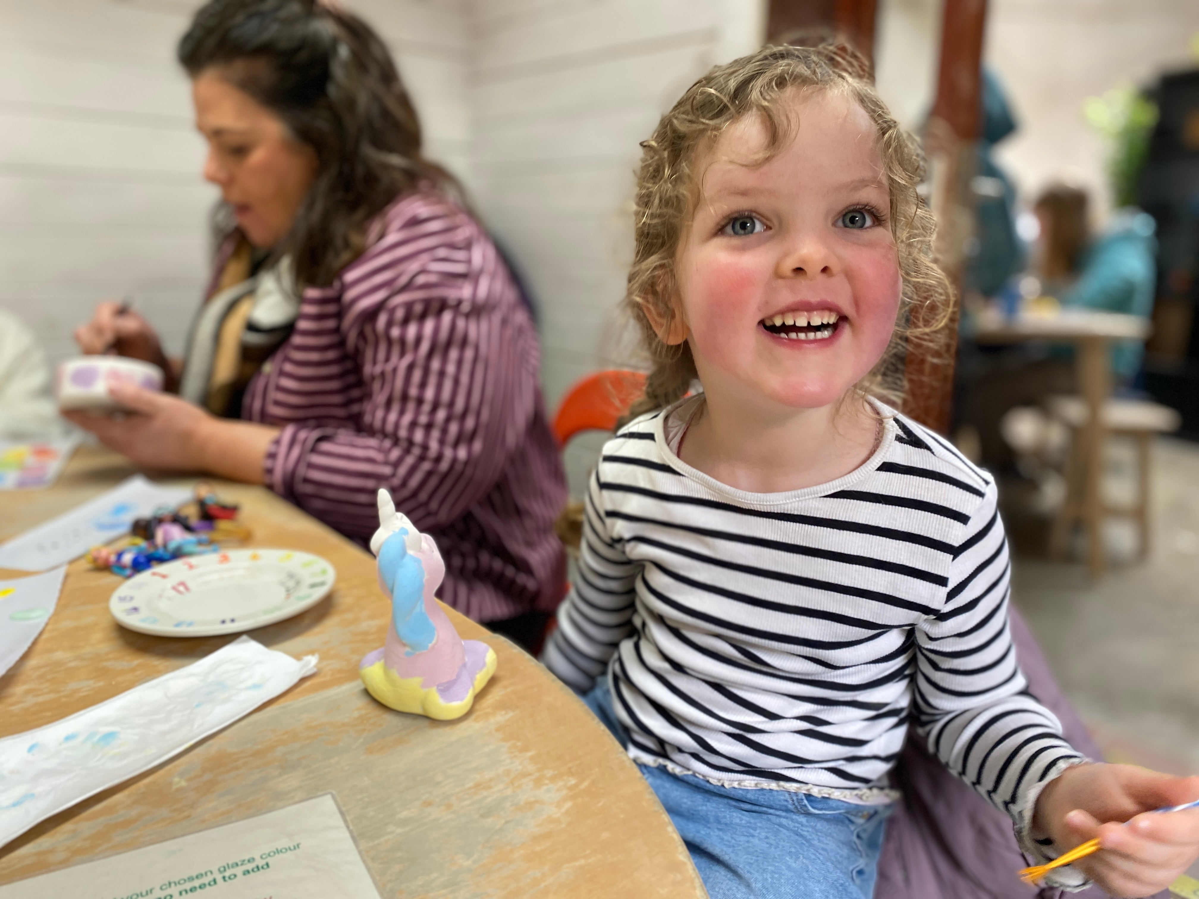 Writer Nick Willis' daughter Lily has fun at the craft centre in Eryri national park
