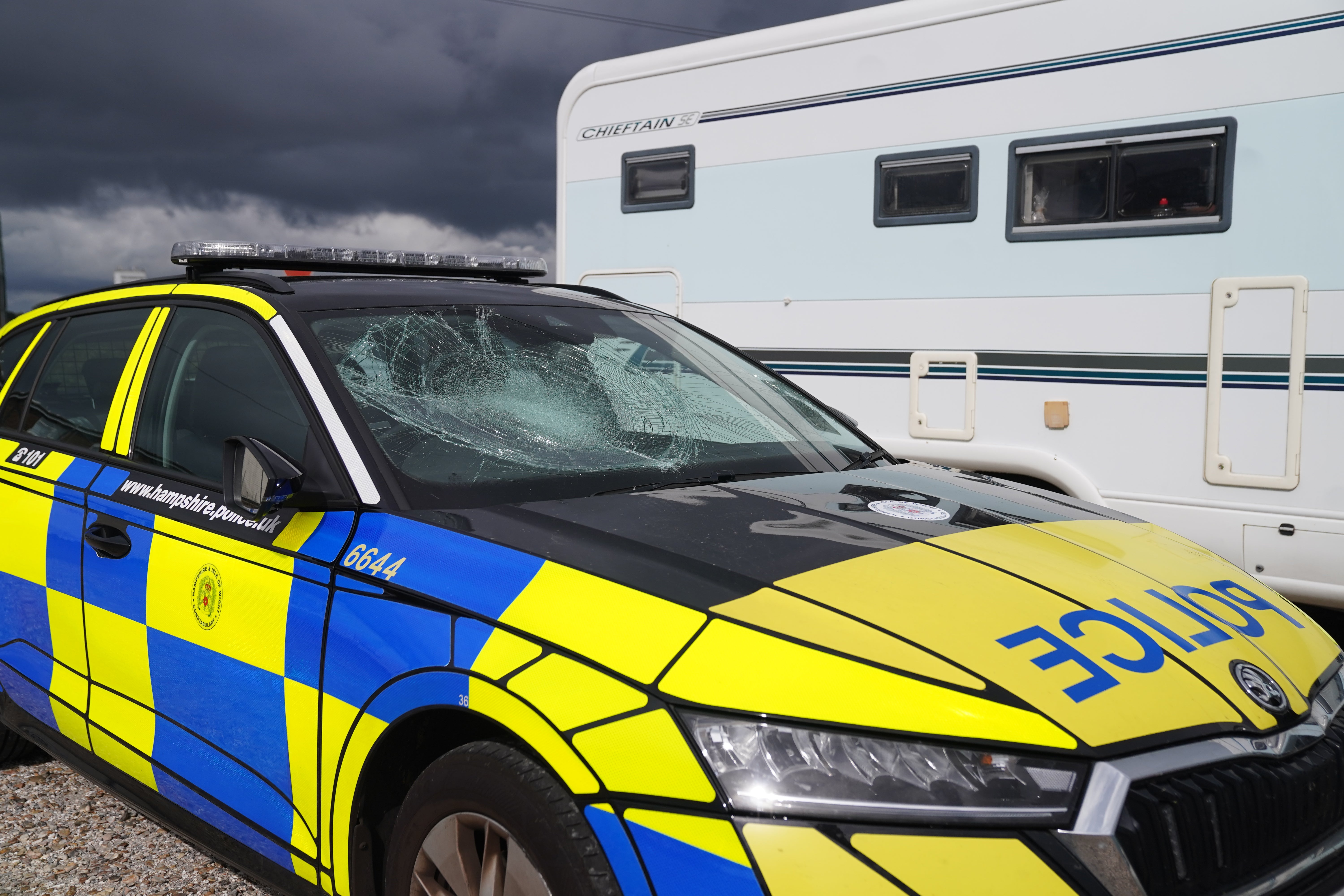 In an ensuing standoff with police, some of the protesters, who were trying to stop the newly arrived migrants from being driven away, attacked officers and vehicles