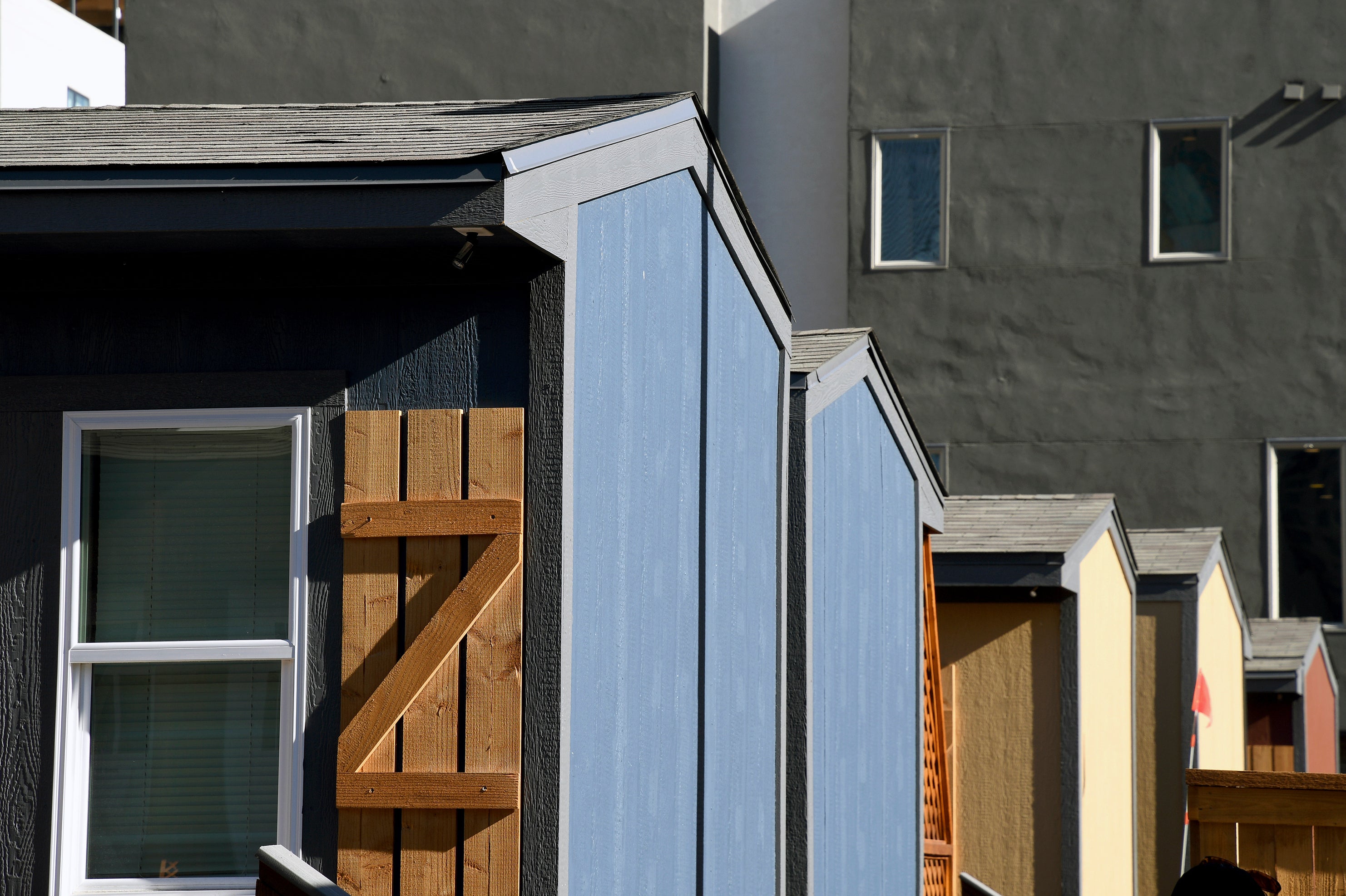 Cabin-like tiny homes are seen at a micro community in Denver