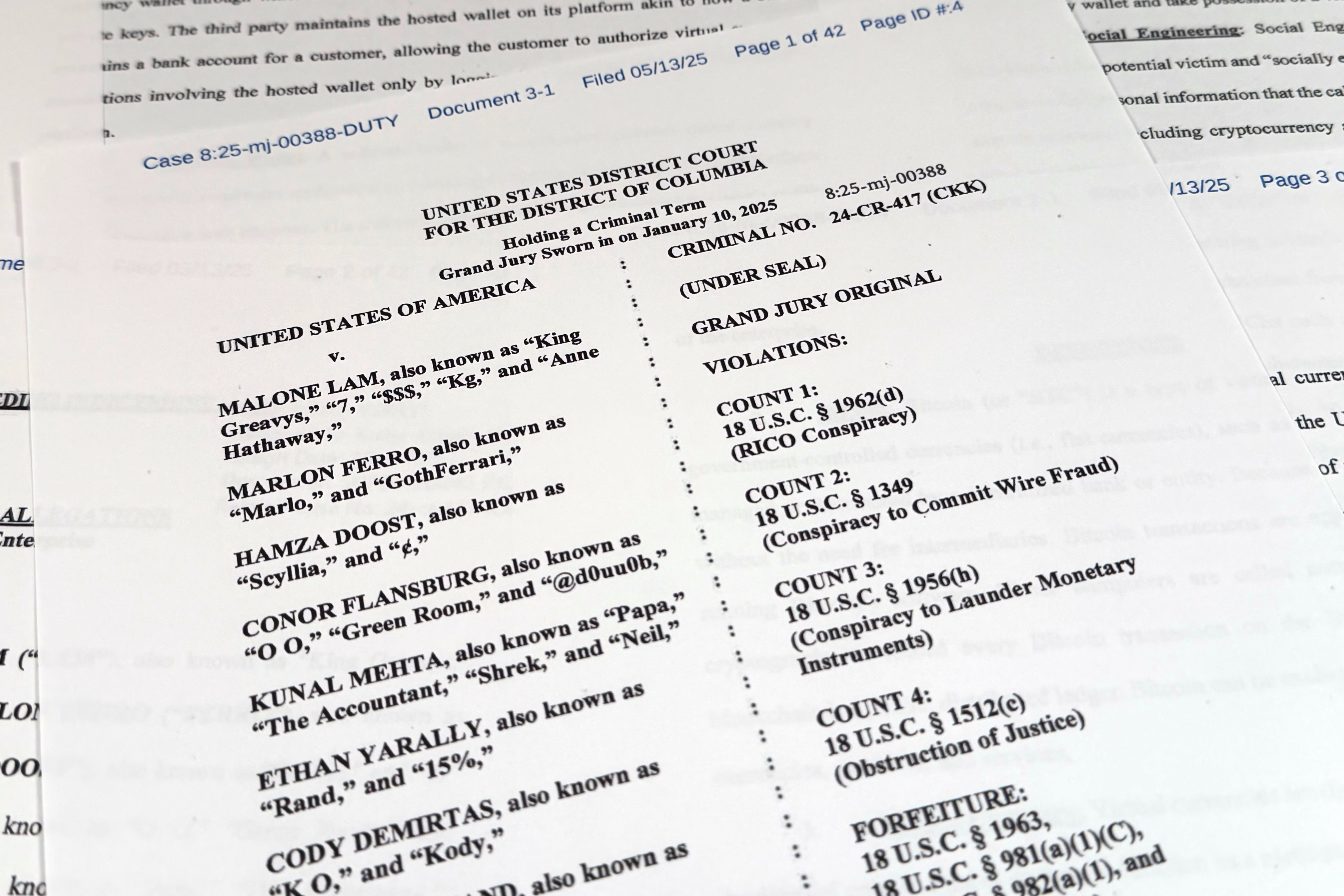 This Justice Department grand jury superseding indictment against Malone Lam and his co-defendants is photographed Friday, Sept. 4, 2026. (AP Photo/Jon Elswick) (Copyright 2026 The Associated Press. All rights reserved.)