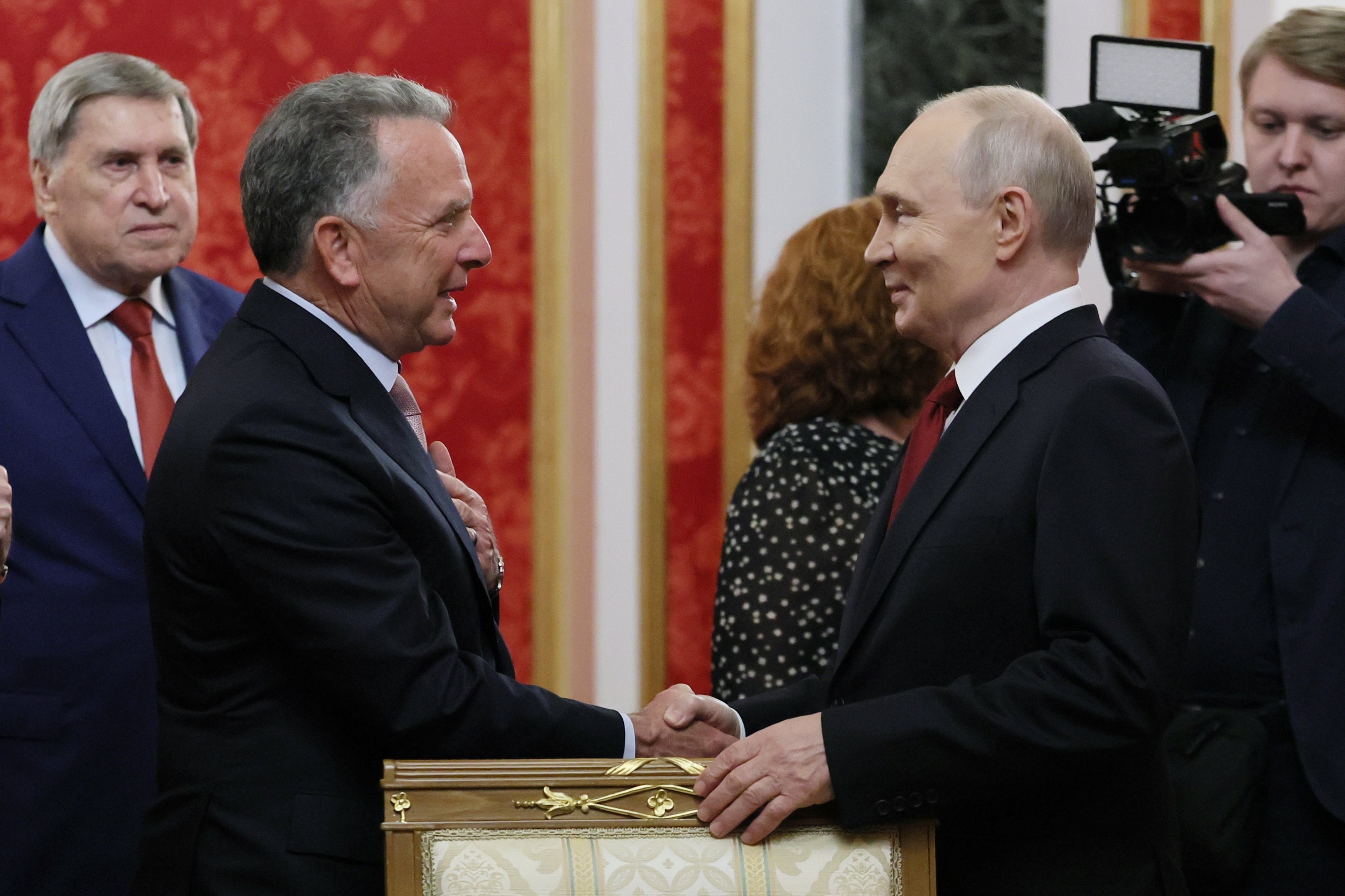 President Vladimir Putin, right, greets U.S. president Donald Trump’s envoy Steve Witkoff, on 5 September (AP)