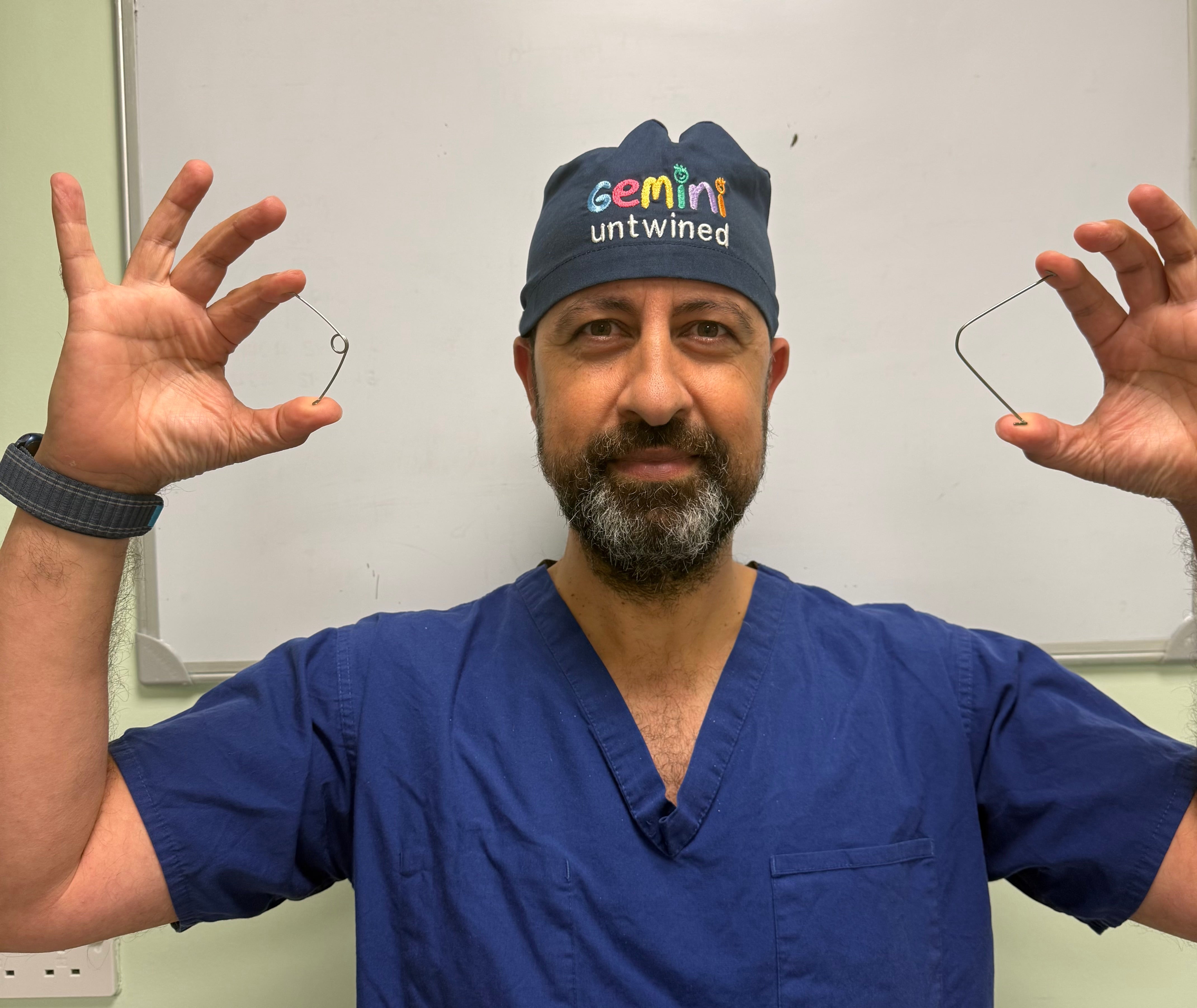 Professor Owase Jeelani, a consultant neurosurgeon at Gosh, holding the new ‘super elastic’ springs