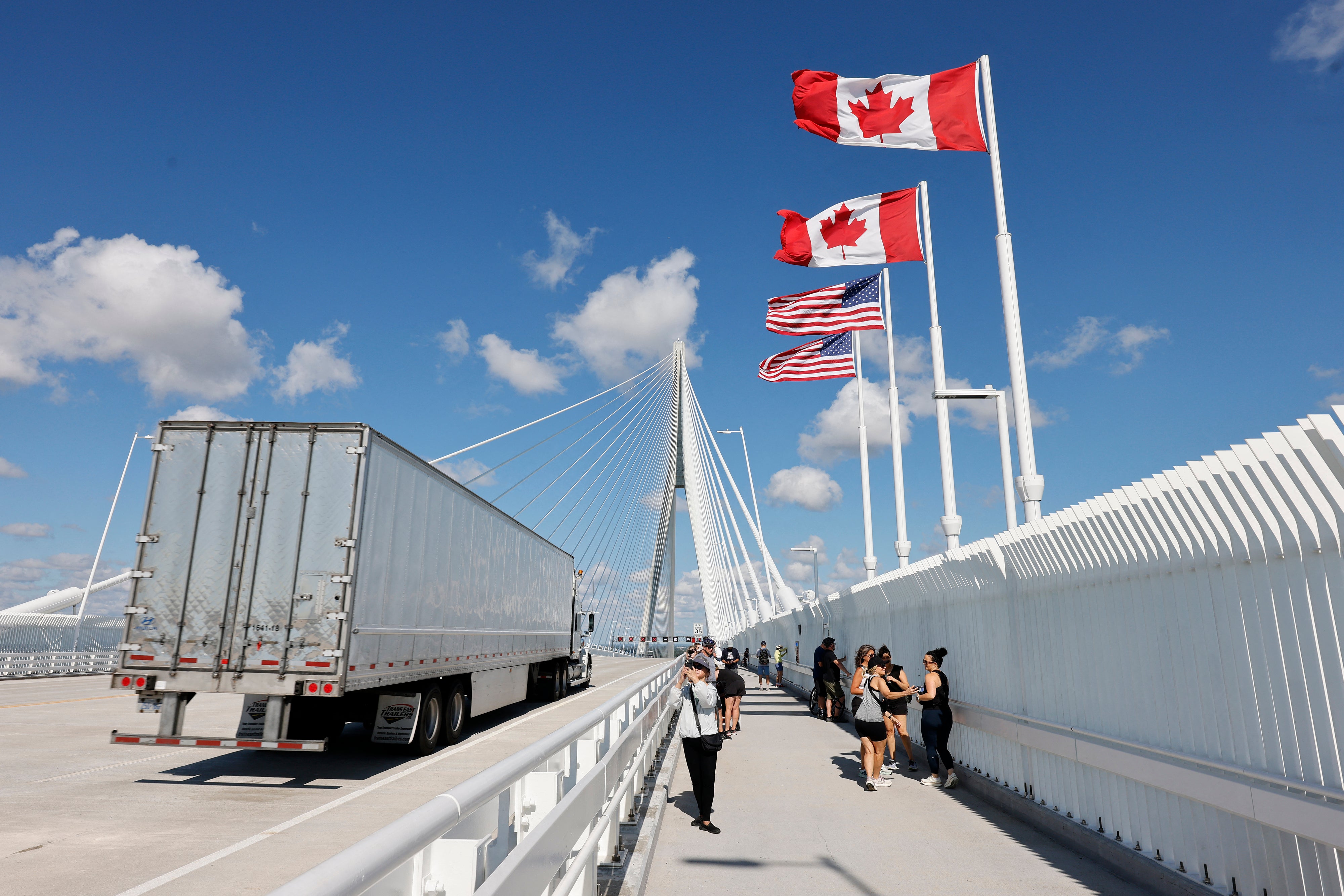 A truck crosses into the United States on the Gordie Howe International Bridge, connecting Windsor, Ontario, and Detroit, Michigan