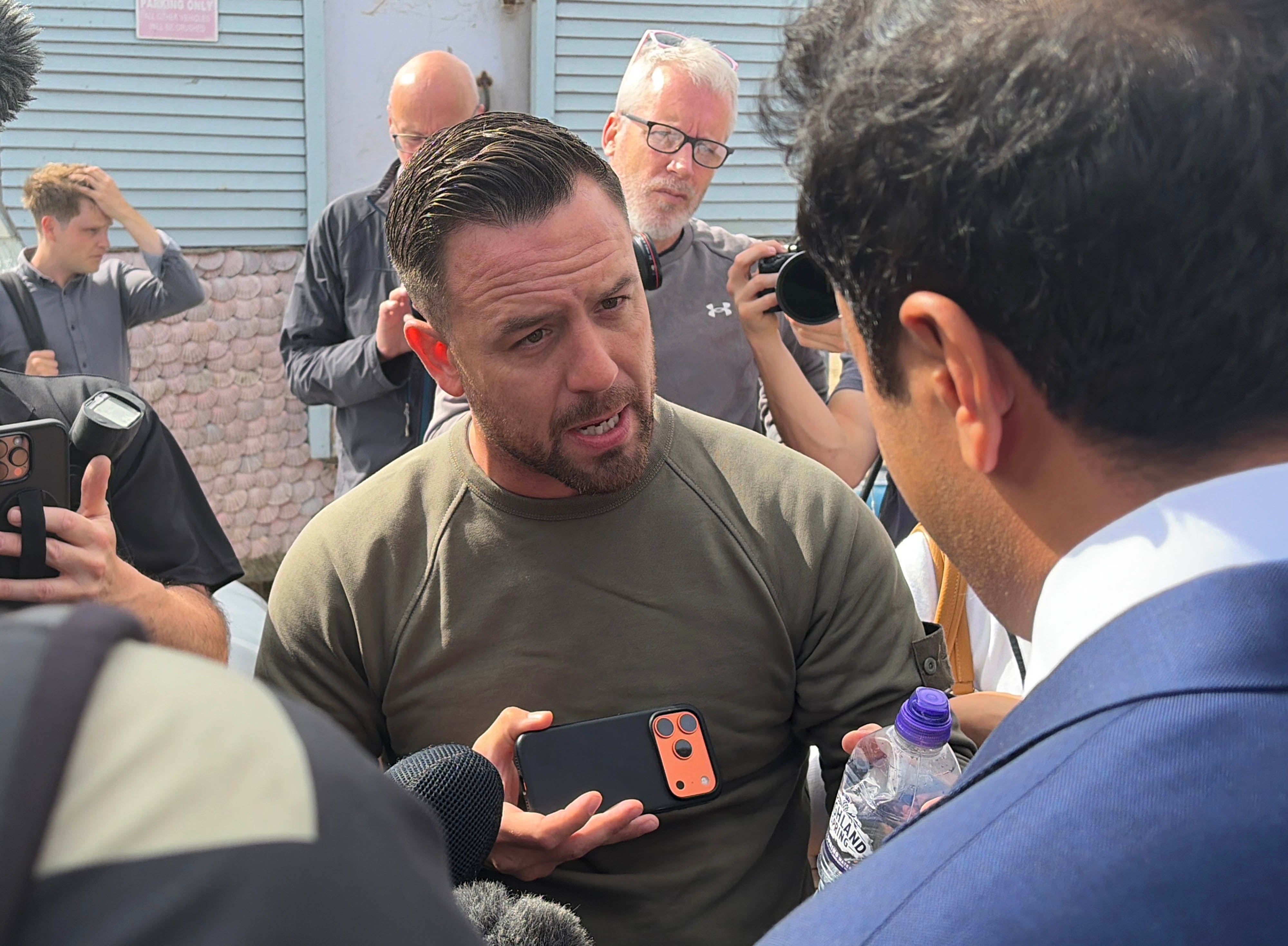 Patriot Platform founder Daniel Thomas, known as Danny Tommo speaking to Reform UK home affairs spokesman Zia Yusuf in Portsmouth