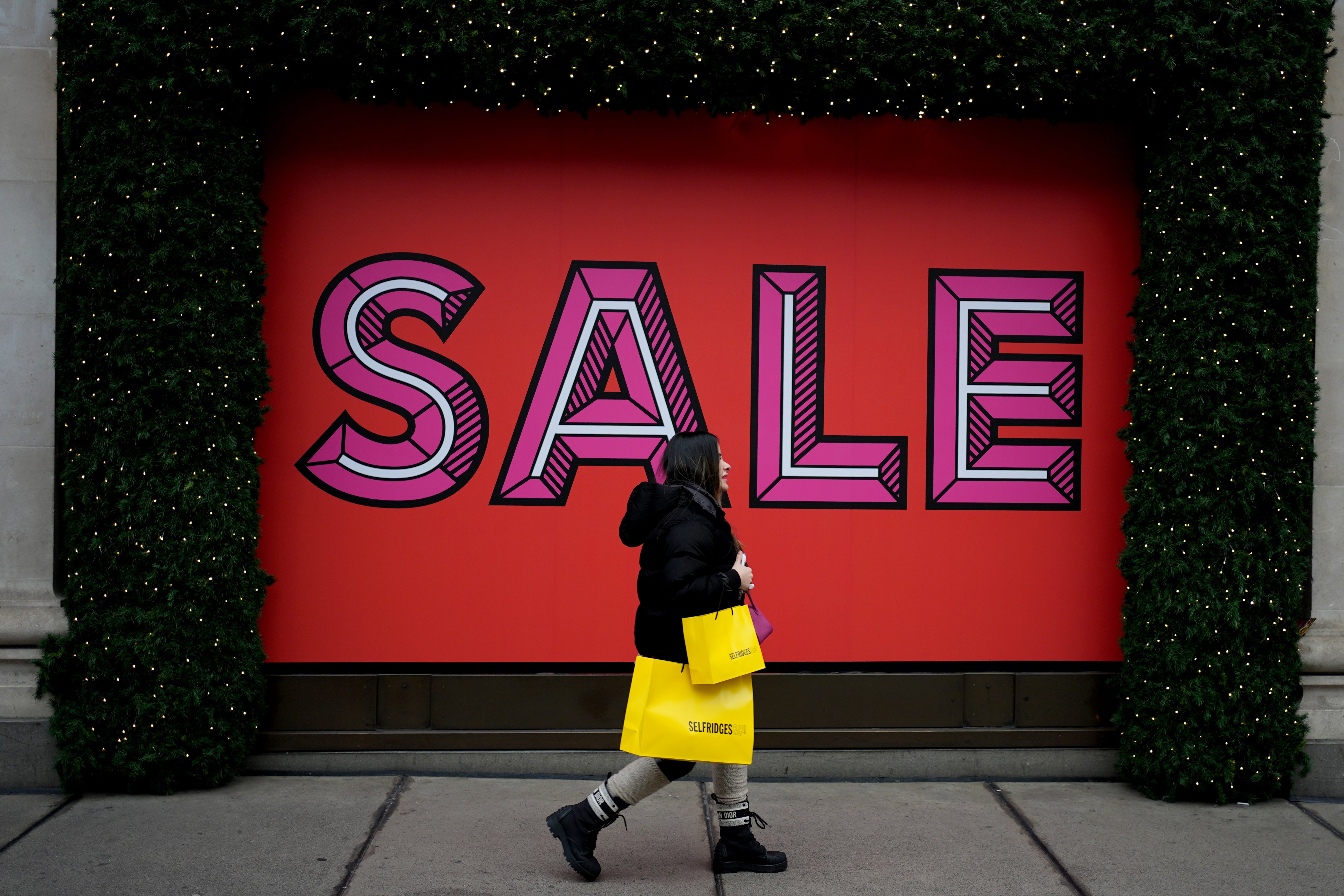 A shopper on Oxford Street, London (Jordan Pettitt/PA)
