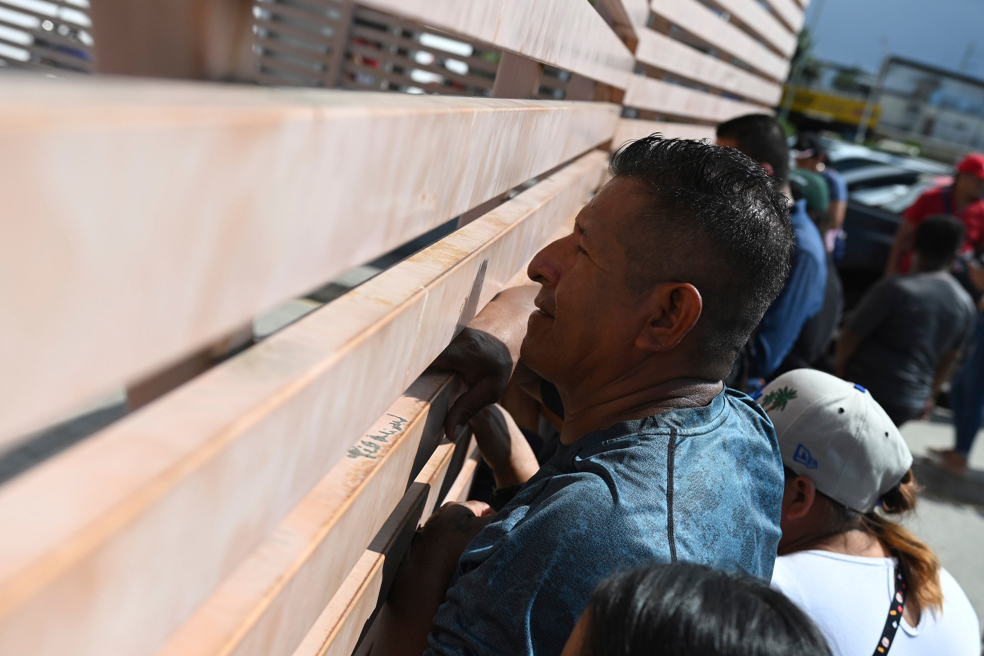 Relatives of crew members of the boat Maria Candelaria peer through a fence outside a police facility in Manta, Ecuador, Monday, Sept. 7, 2026, as they wait for the crew to return after the boat was intercepted by U.S. authorities on suspicion of alleged drug trafficking. (AP)