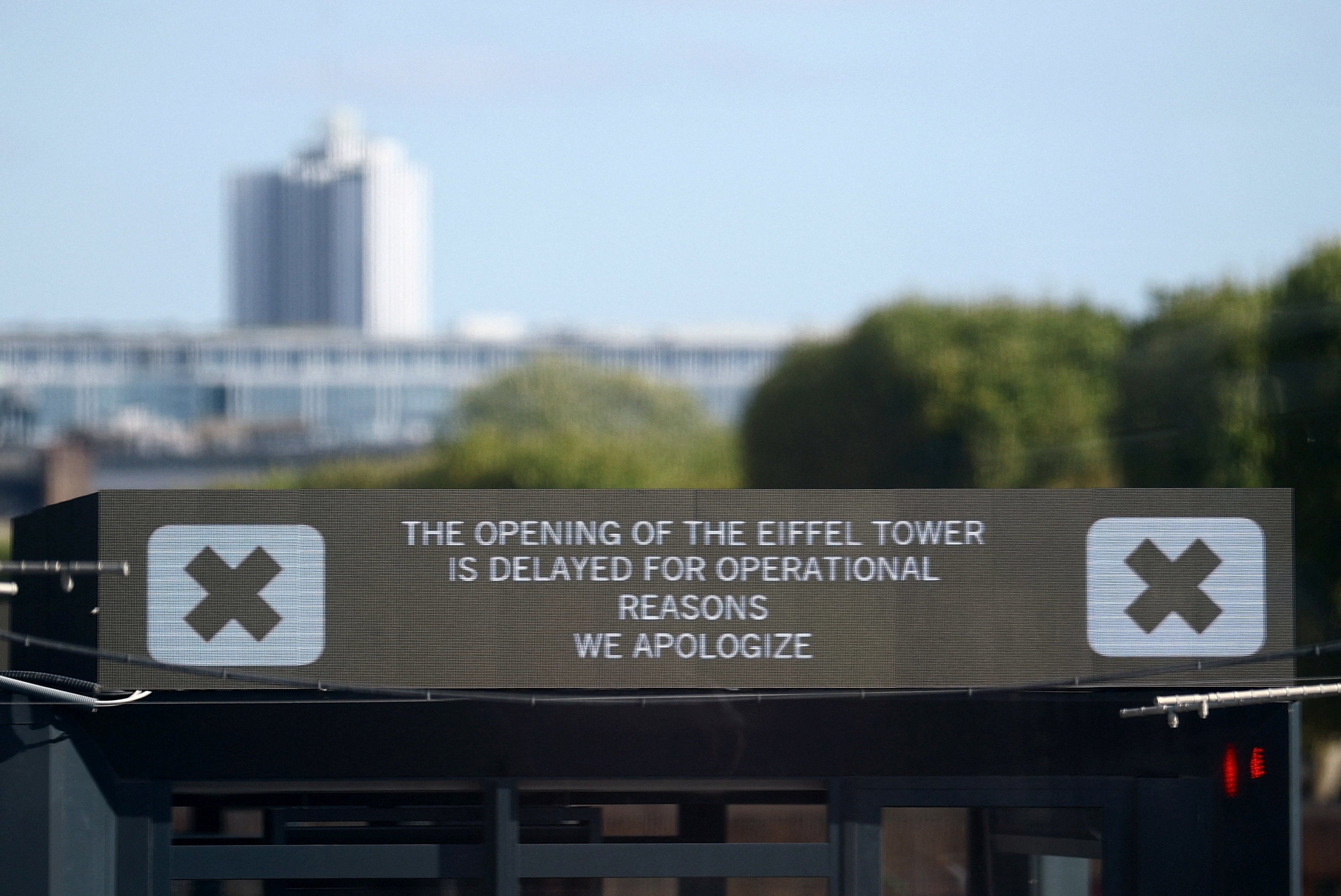A sign reading 'the opening of the Eiffel Tower is delayed for operational reasons, we apologize' is seen at the Eiffel Tower in Paris, France, 7 September 2026